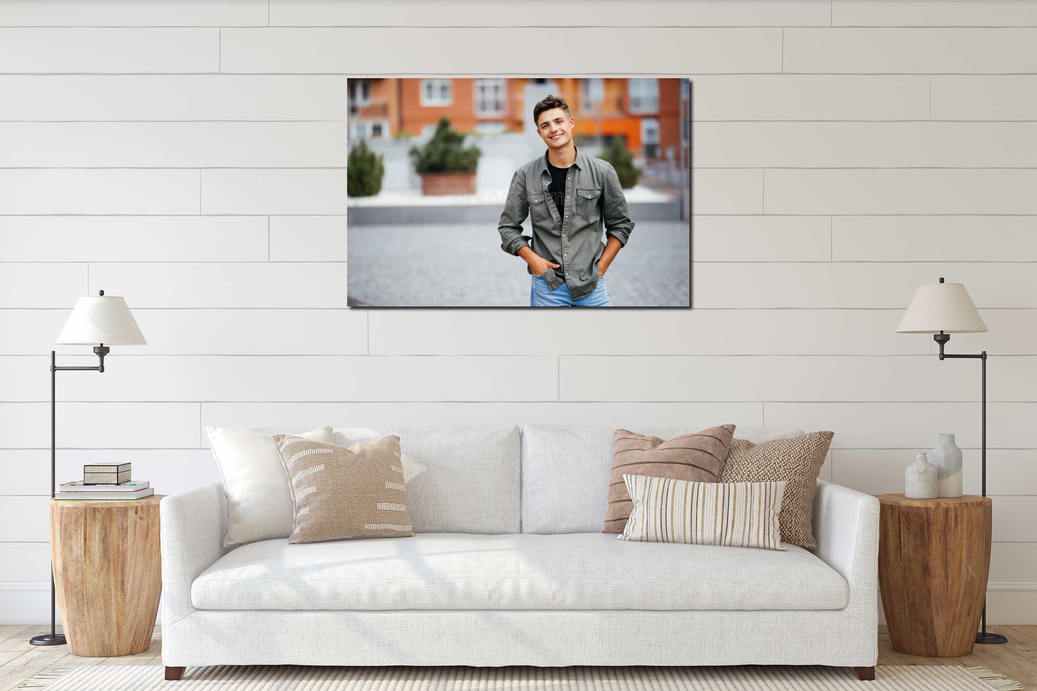 Handsome smiling young man portrait. Cheerful man looking at camera interior mockup