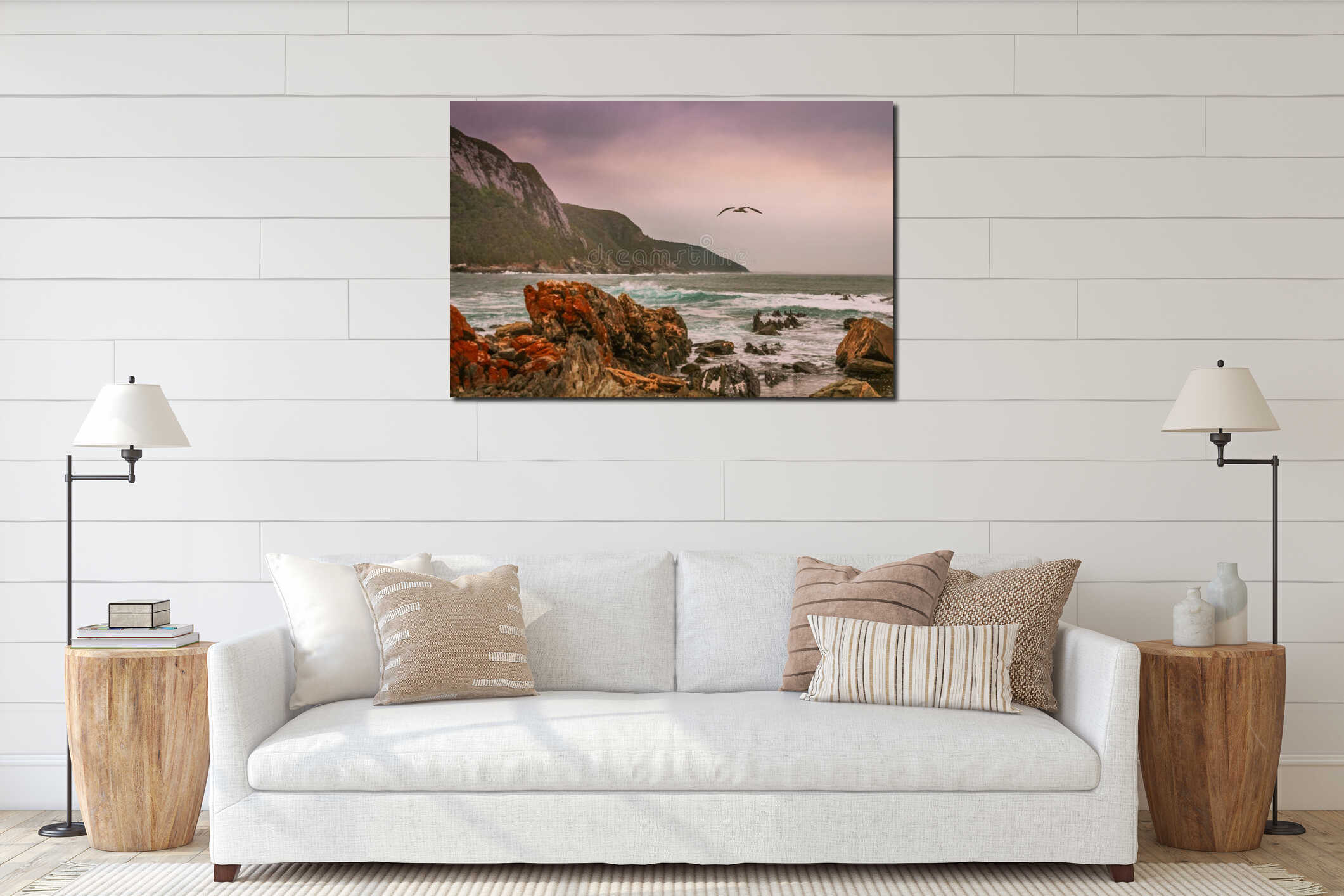 Seagull flying over ocean with rocky beach interior mockup