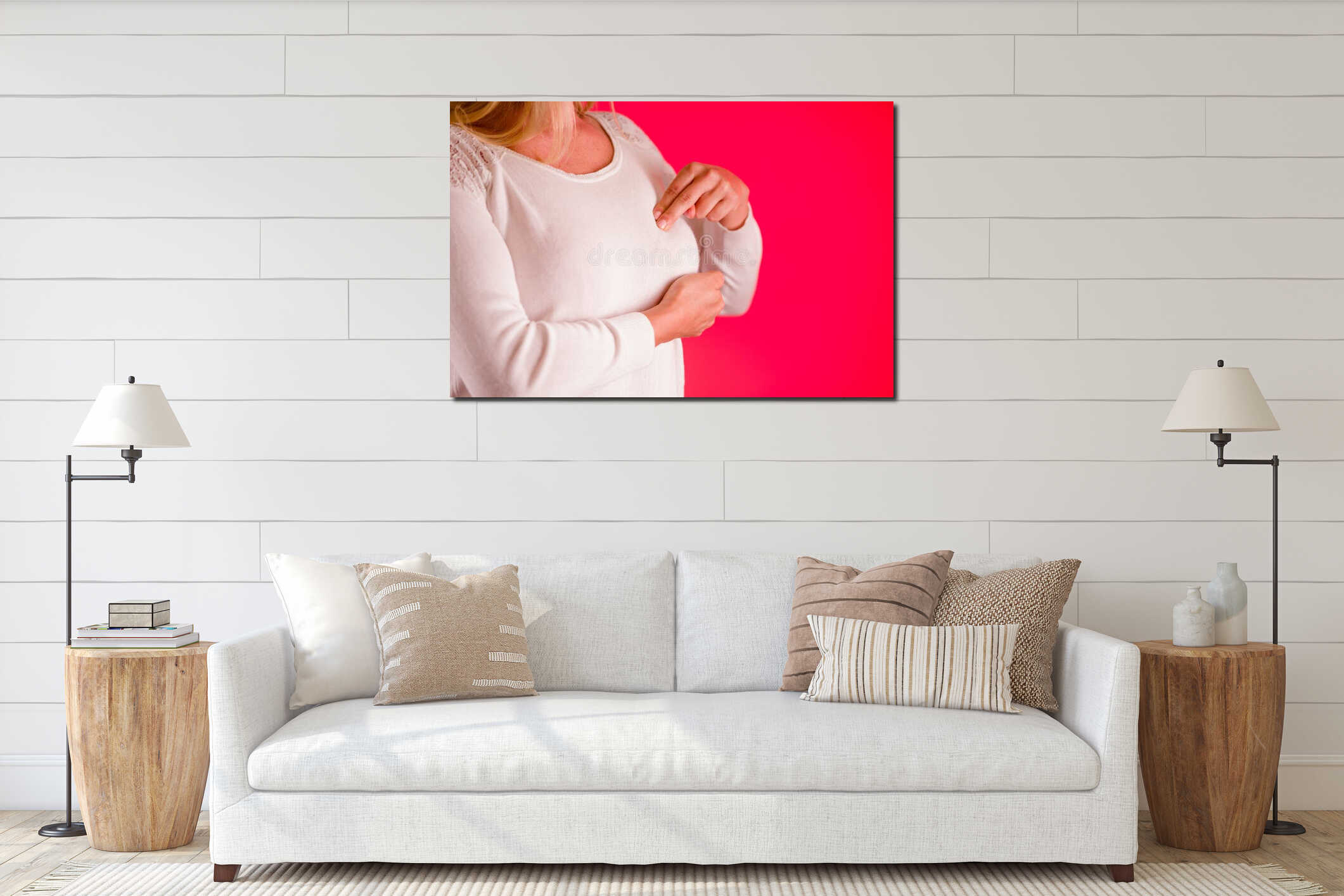 Closeup cropped portrait young woman with breast pain touching chest, on pink background interior mockup
