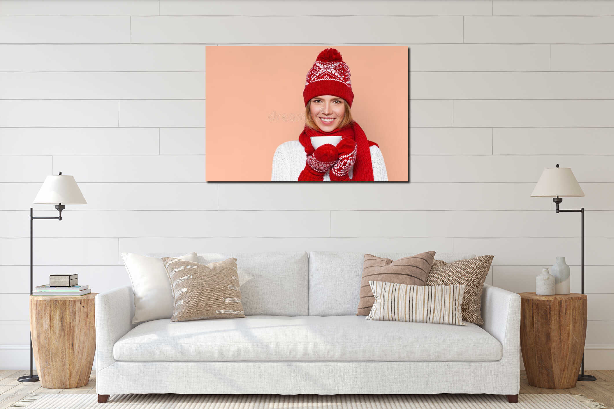 Happy winter girl in knitted warm hat and mittens holding a cup in hands. Smilling Christmas woman, isolated interior mockup