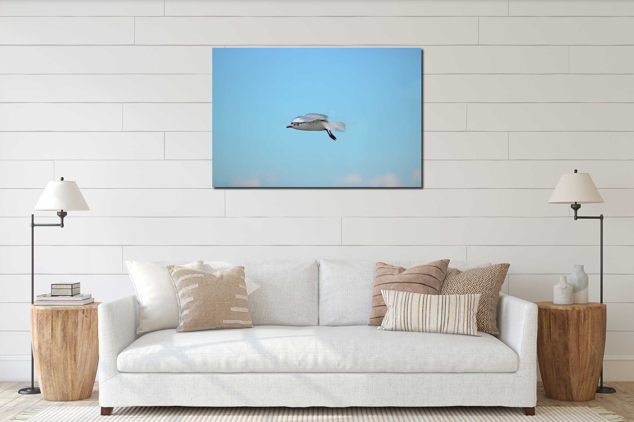 White seagull flying in the blue sky Science name is Charadriiformes Laridae . Selective focus and shallow depth of field. interior mockup