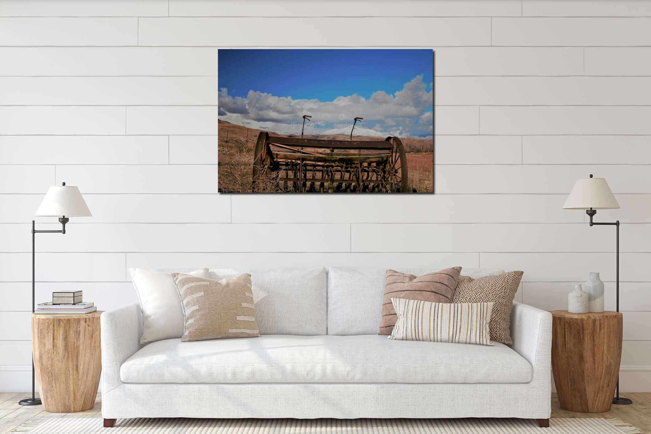 Antique farm equipment in front of snow capped mountains interior mockup