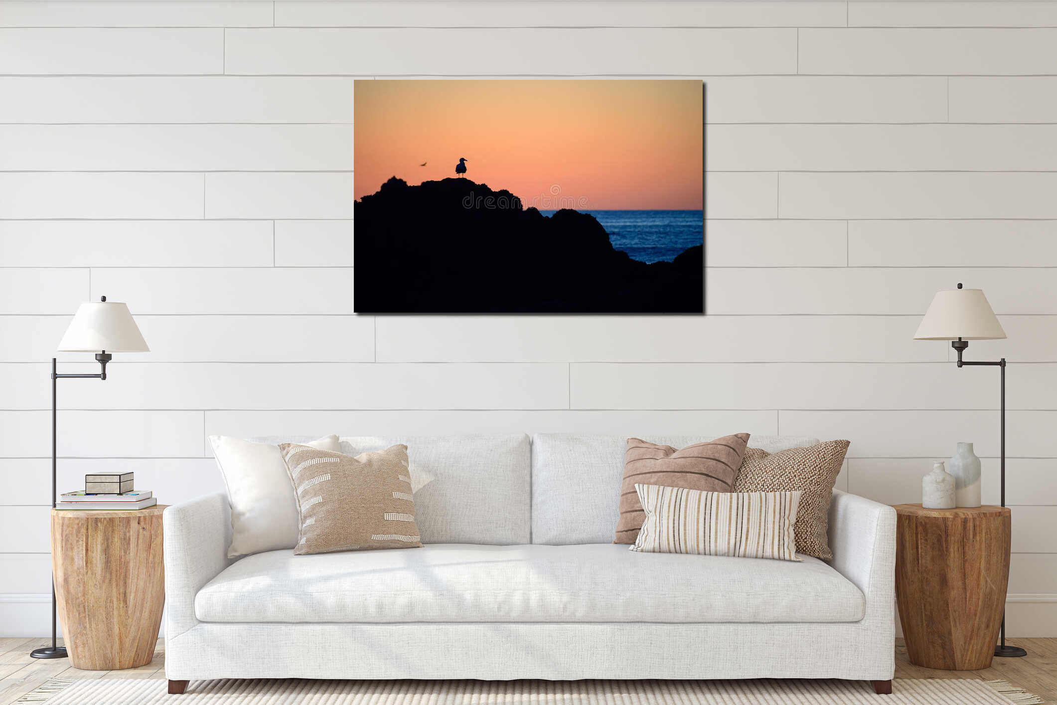 Black silhouette of seagull on the rocks ocean on background interior mockup