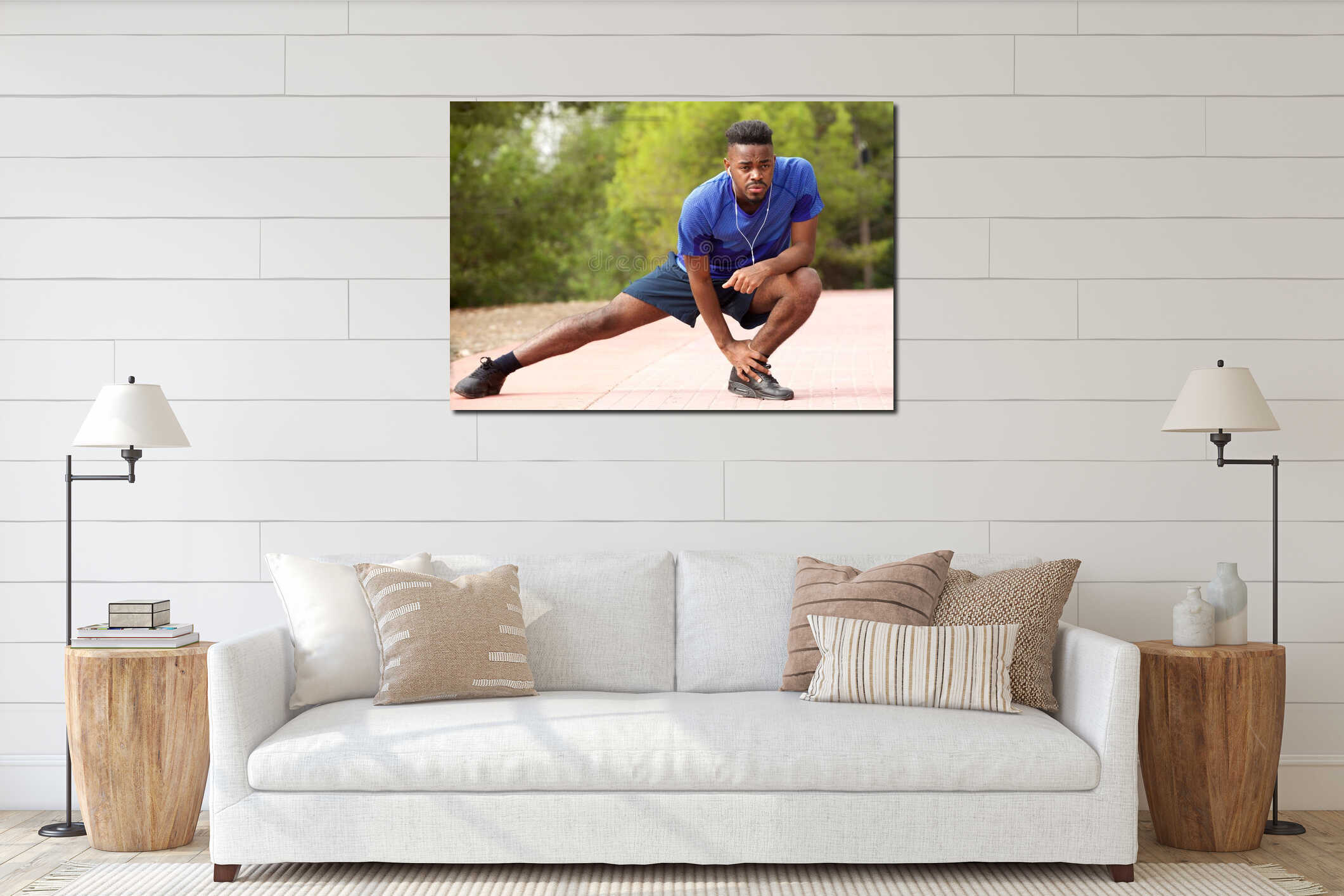 Fit young african american man doing stretching exercise while listening to music with earphones interior mockup