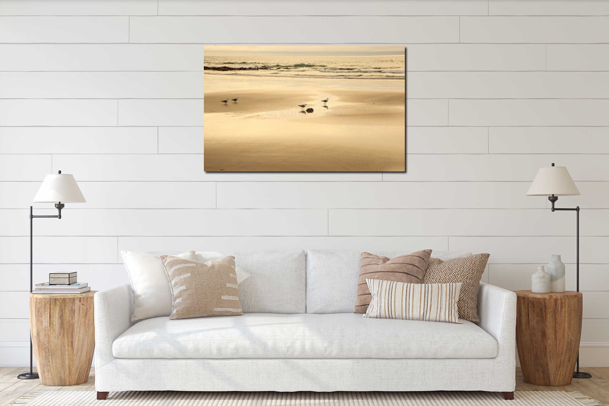 Seagull Seabirds finding food on beautiful glowing, glittering sandy beach with sunrise reflecting golden morning light on wet sea interior mockup