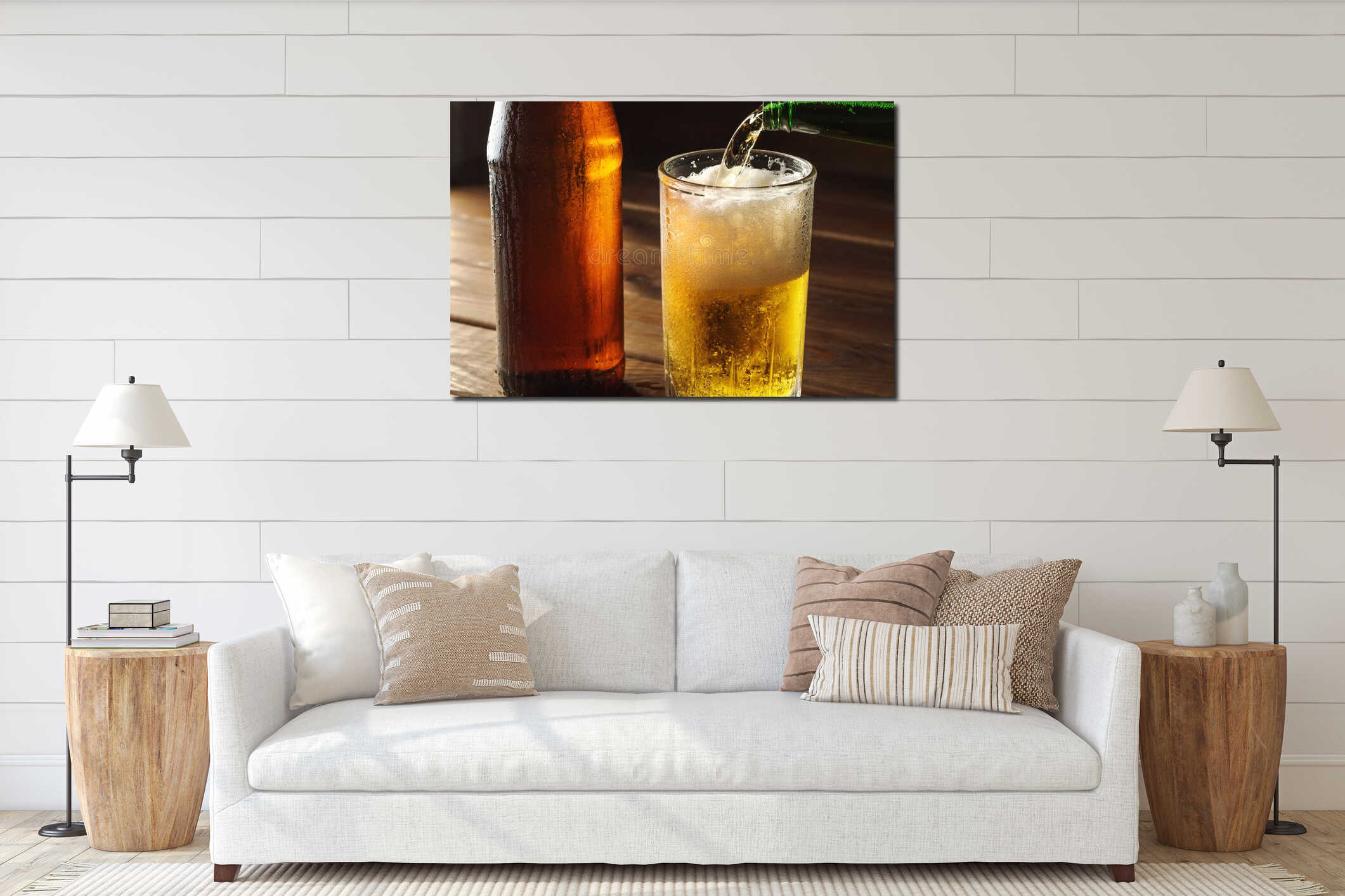 Pouring foaming beer into glass mug with drops near cold beer bootle on wooden table, craft brewing interior mockup