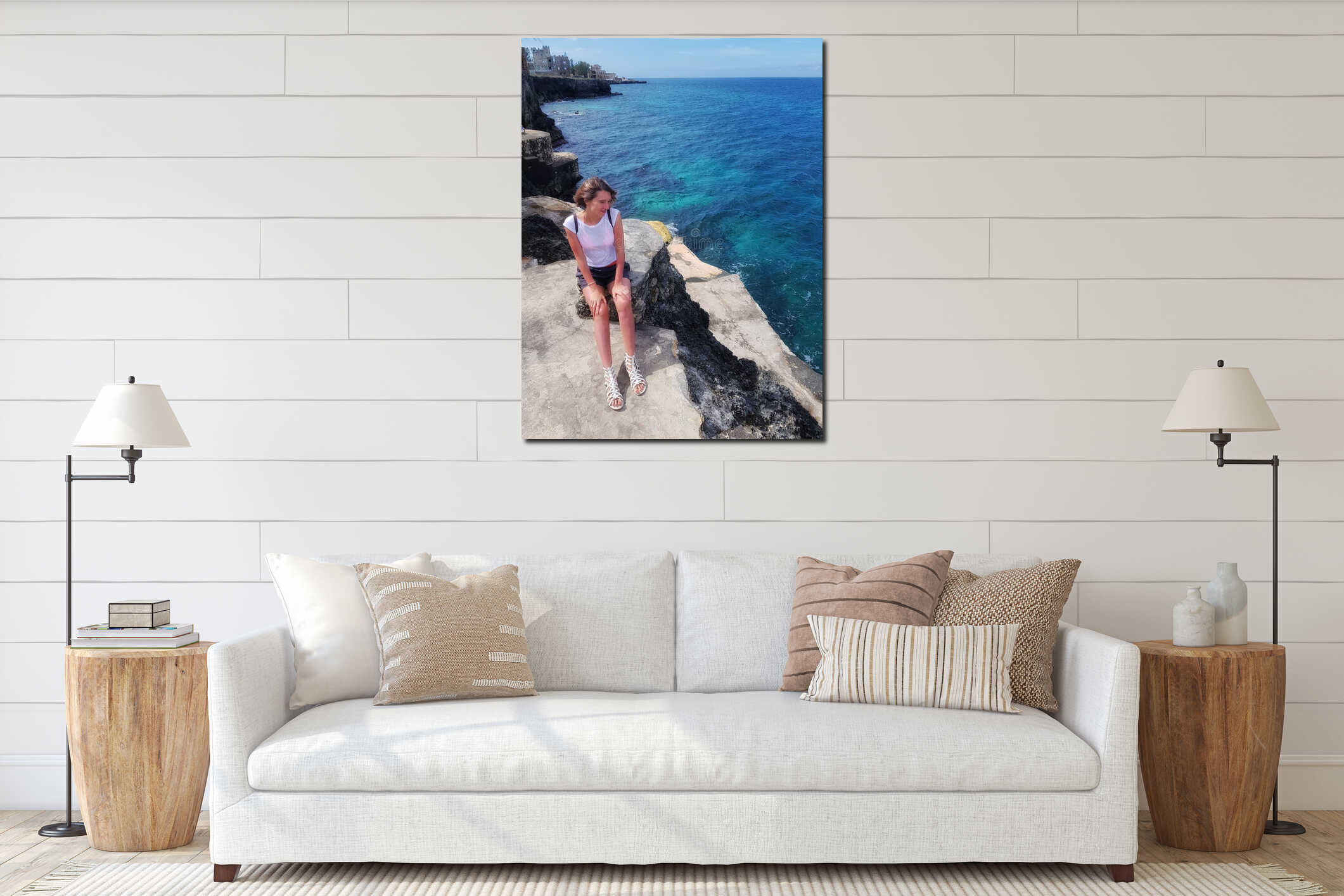 Girl stands on rocks, rocks and looks at the Caribbean Sea interior mockup