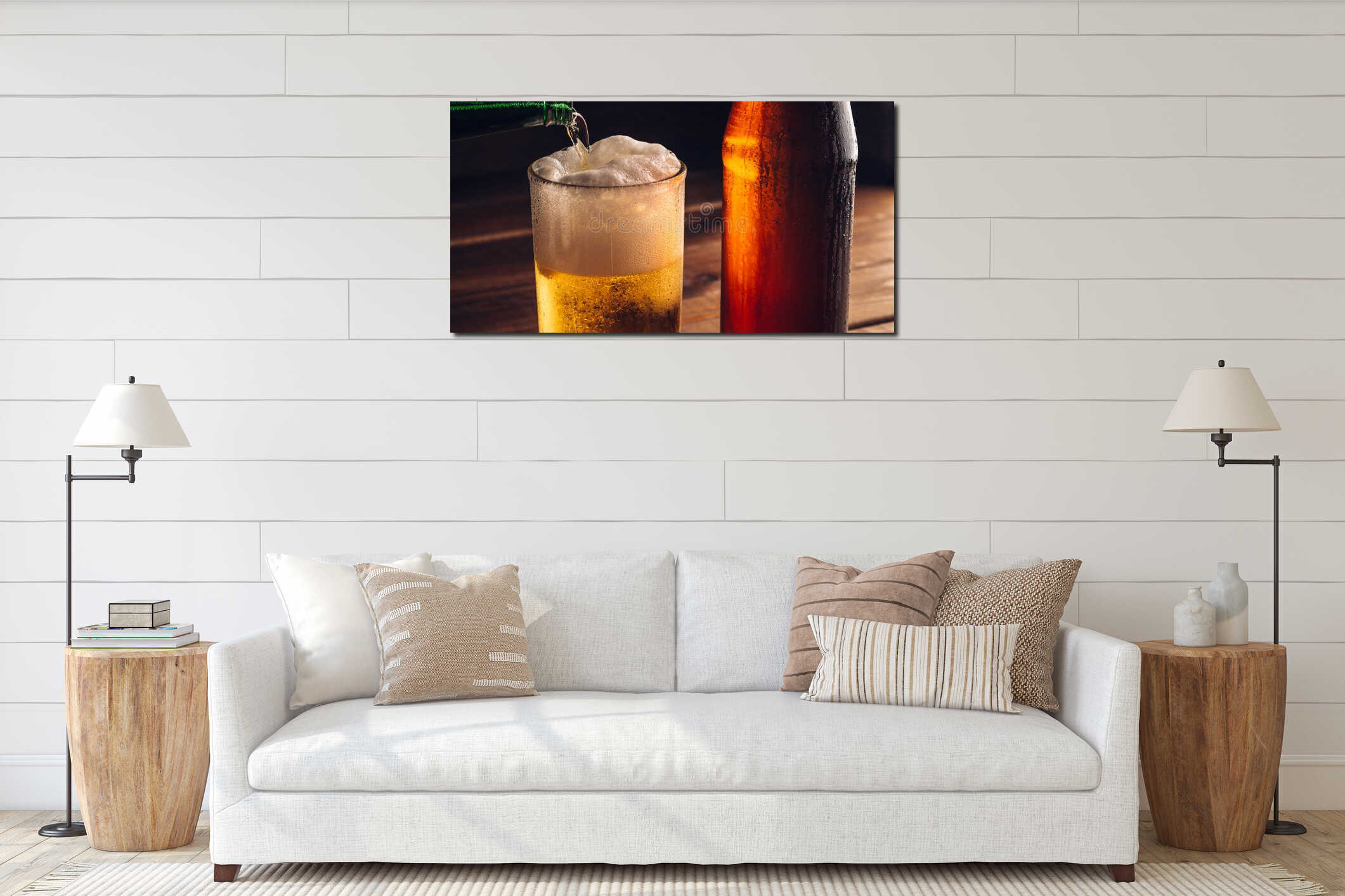Pouring foaming beer into glass mug with drops near cold beer bootle on wooden table, craft brewing interior mockup