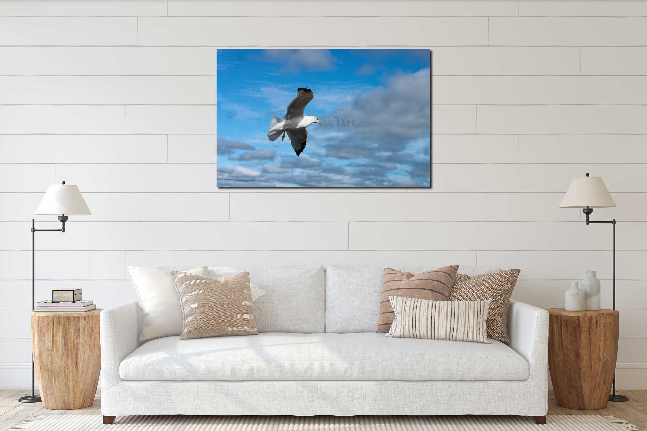 Closeup of seagull in flight against stormy cloudy sky interior mockup
