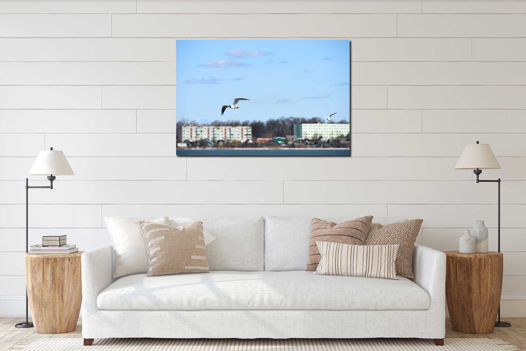 Birds of the seagull fly over the lake water in the city on the background of houses interior mockup