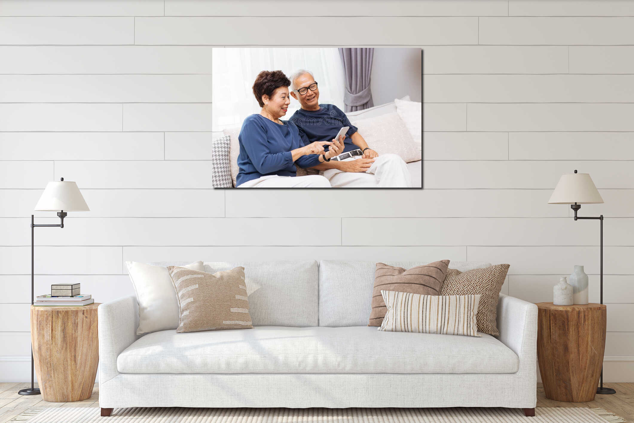 Senior Asian couple grandparents using a smart phone together on sofa at home. interior mockup