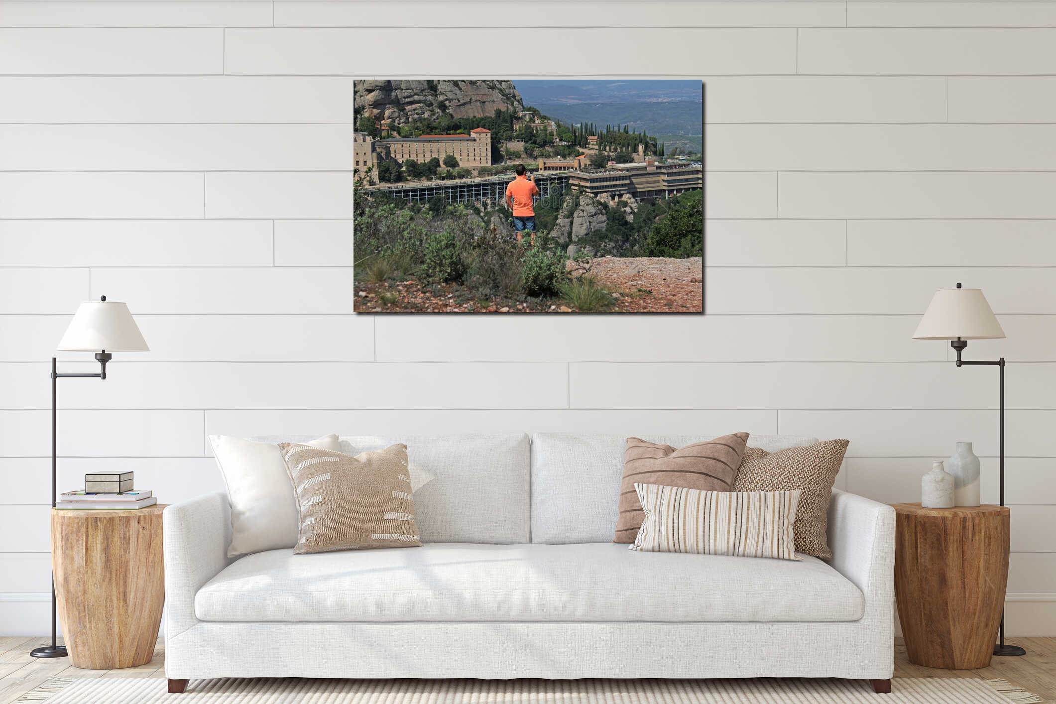 Rear view of man photographing view of Montserrat mountains and the Benedictine abbey of Santa Maria de Montserrat on a portable c interior mockup