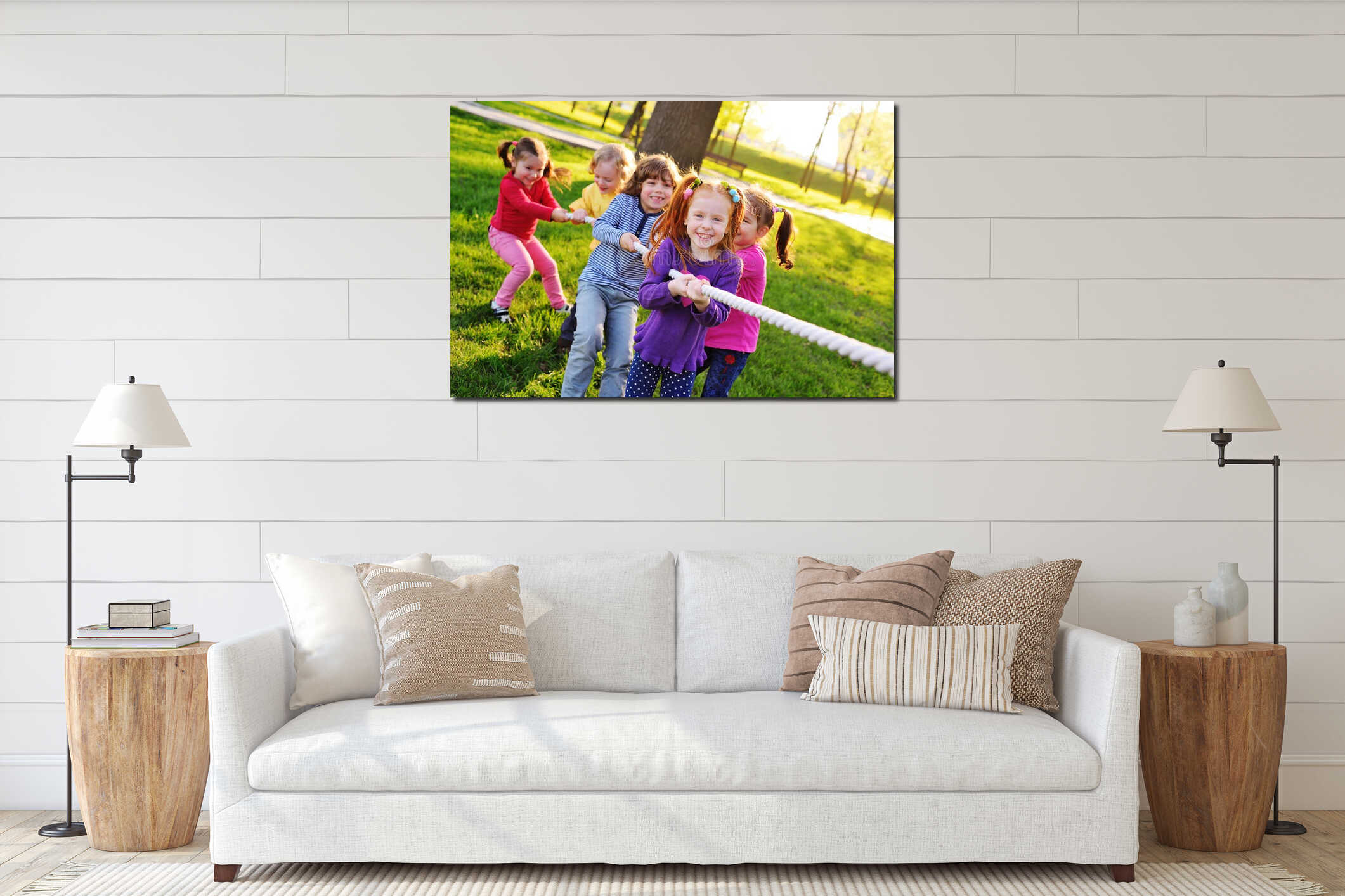 A group of small preschool children play a tug of war in the park. interior mockup