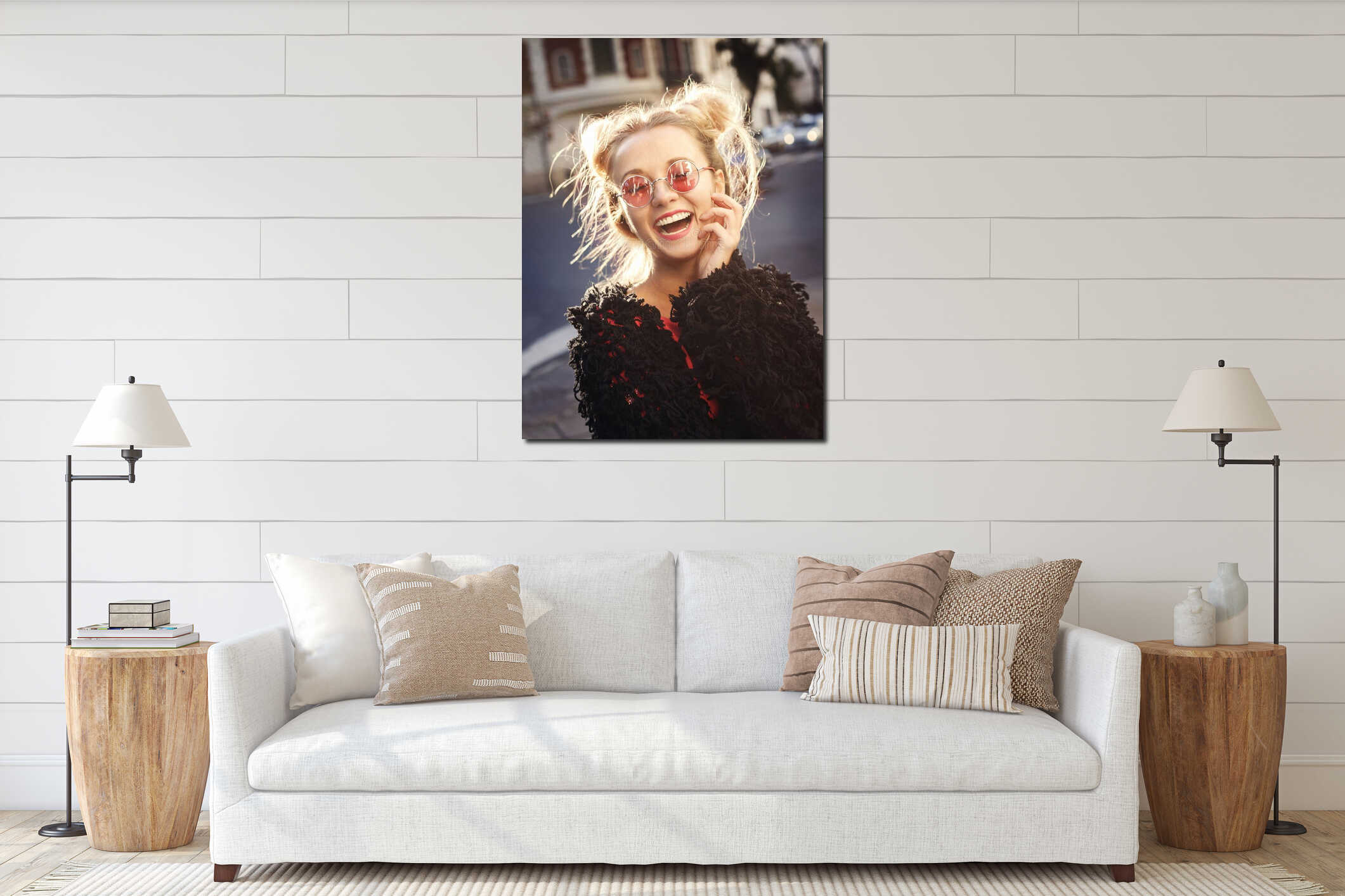 Cheerful blonde girl in rose glasses laughing at loud interior mockup