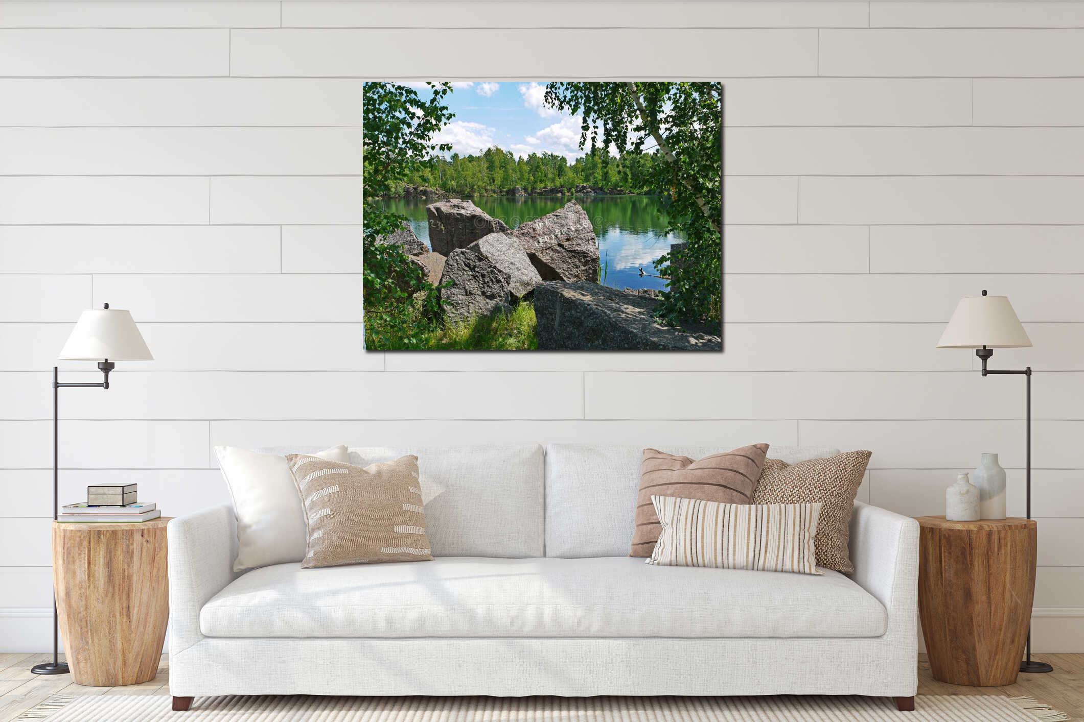 Pointed, huge stones lie on the shore of a clean lake with mirror water interior mockup