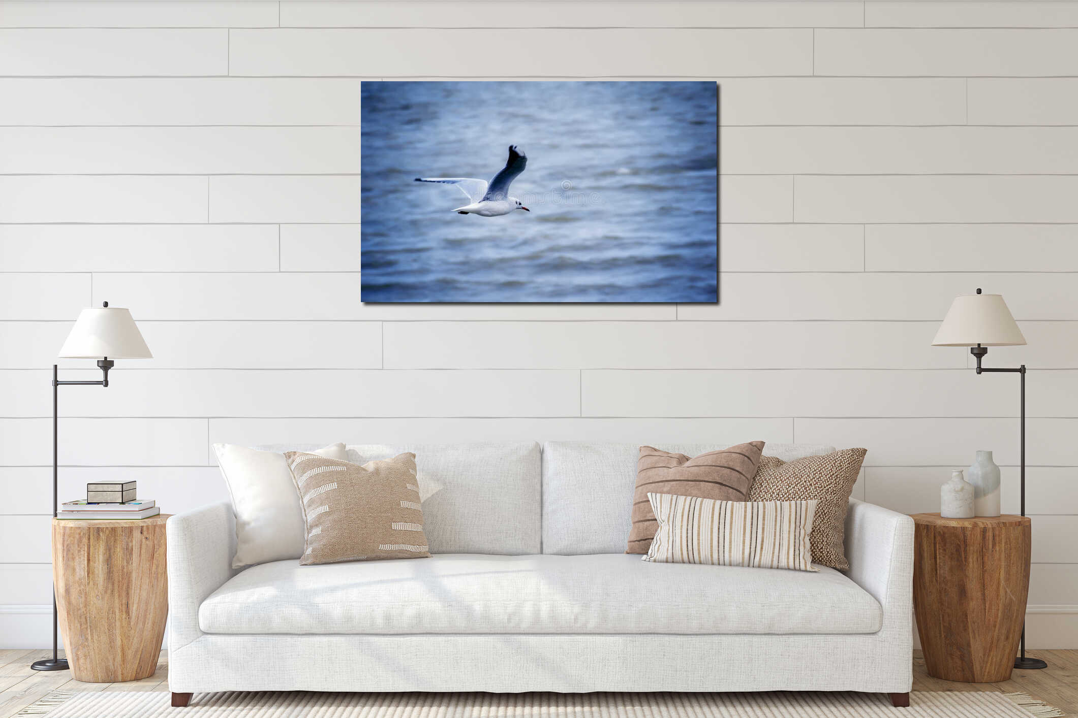 Seagull flying above the waves, selective focus interior mockup