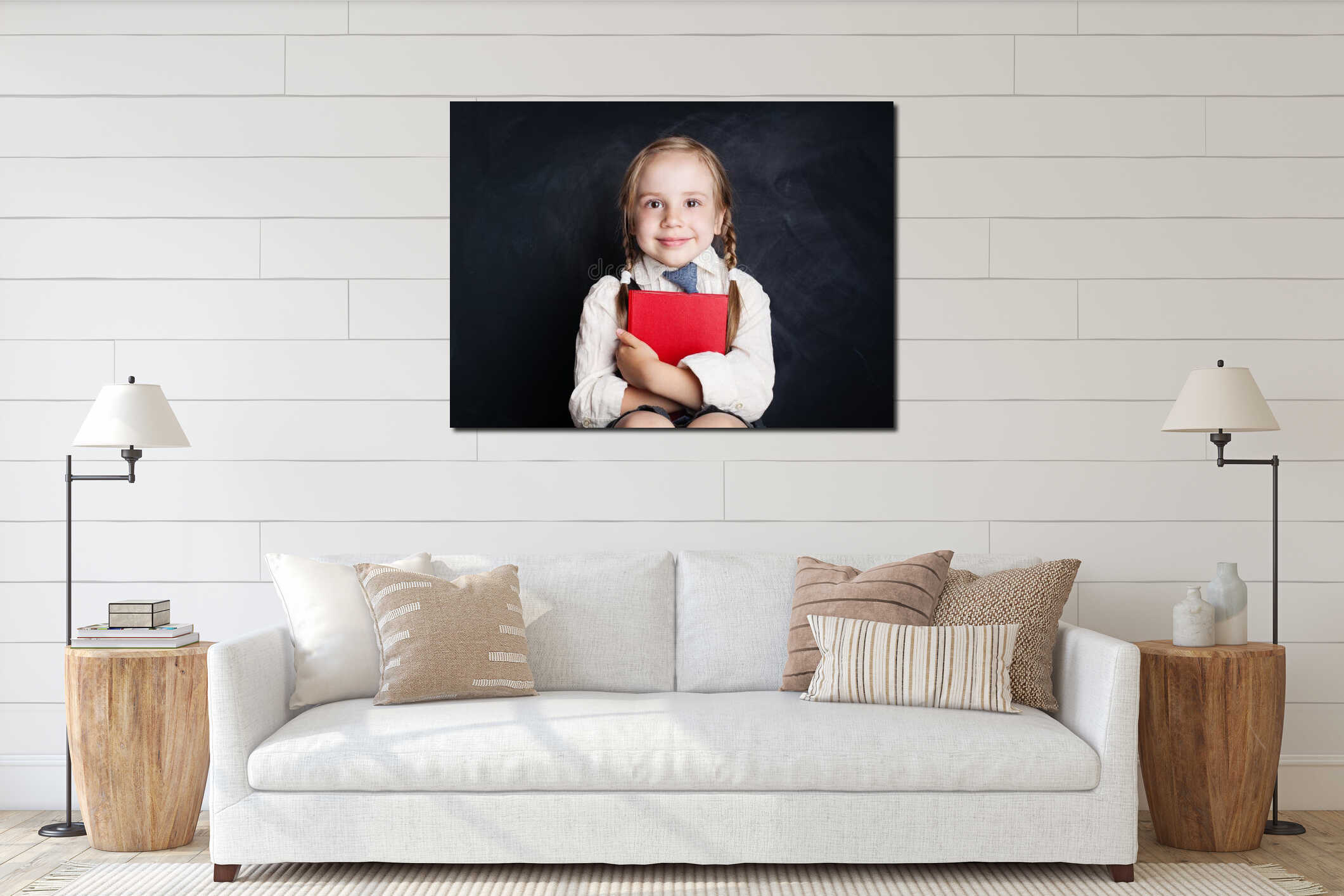 Cute little girl with book. Happy Child on empty blackboard interior mockup