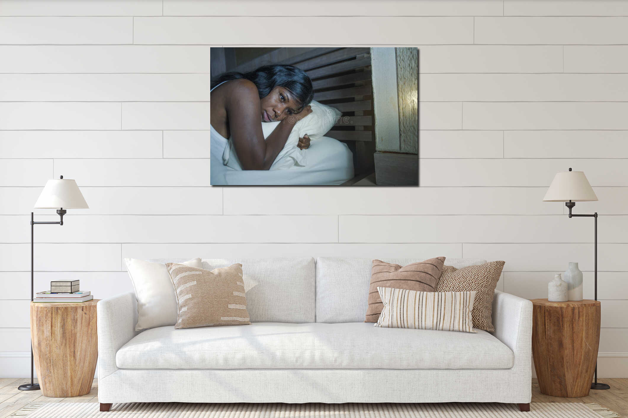 Night portrait of young sad and worried black afro American woman in bed at home sleepless and stressed feeling depressed sufferin interior mockup