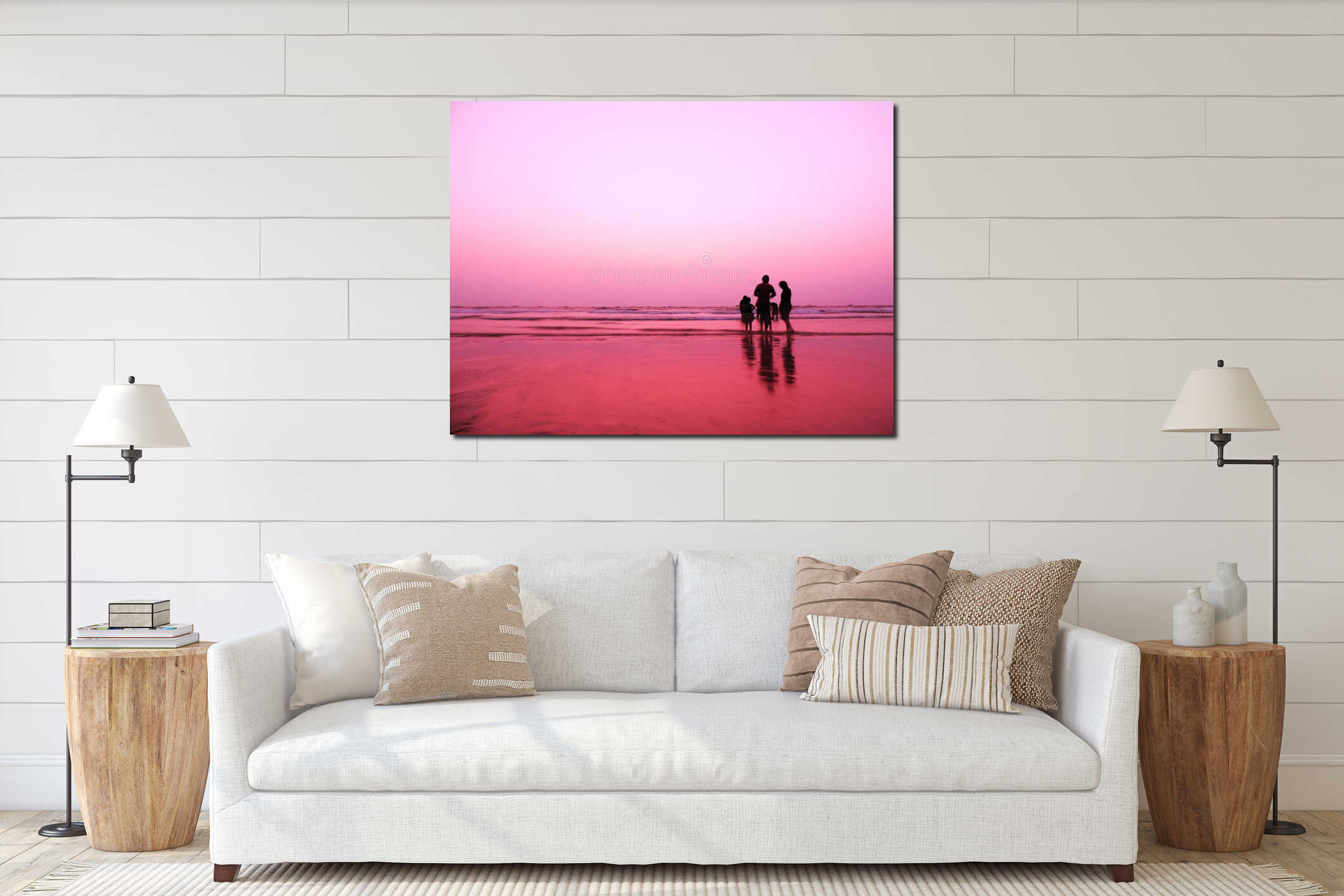 After sunset image of a beach with gentle pink purple sky color along with silhouette of a happy family with friends playing interior mockup