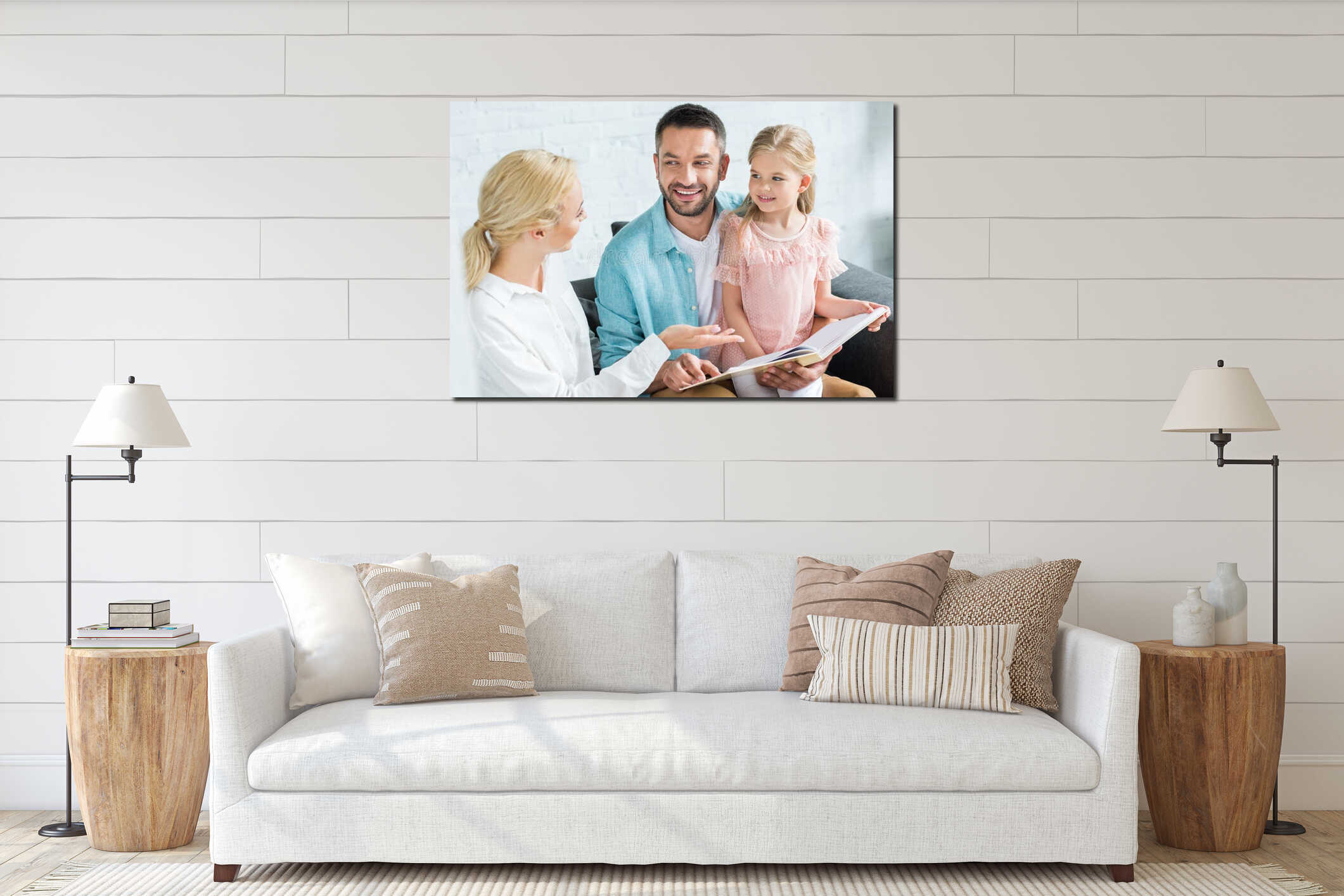 happy parents with cute little daughter reading book together interior mockup