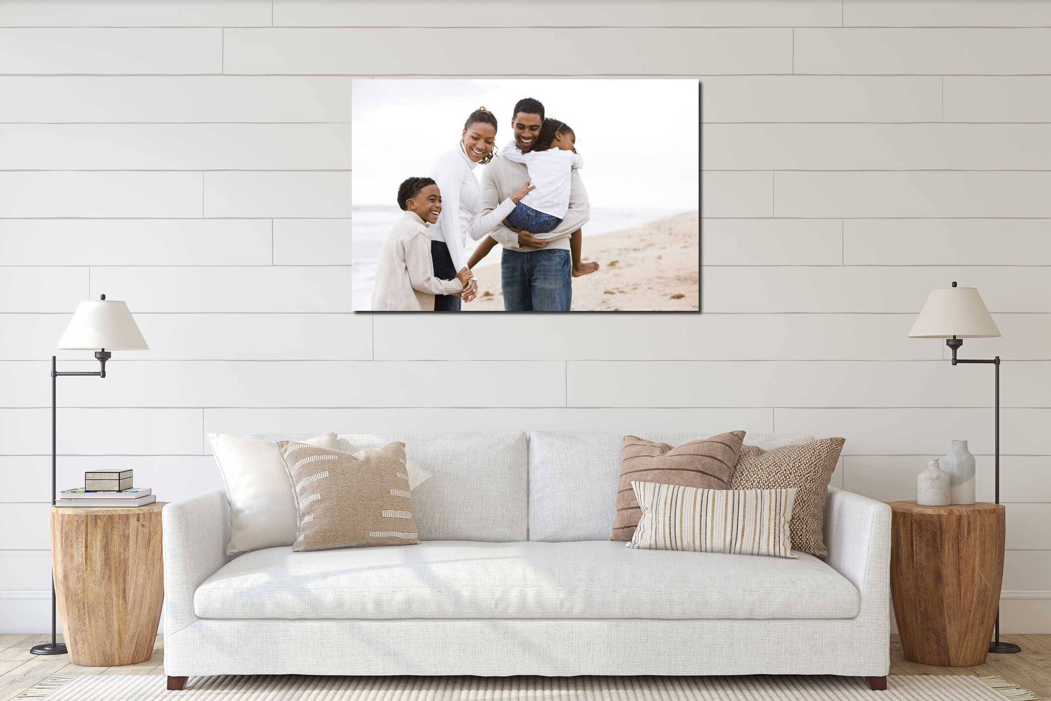 Happy African-American family of four on beach interior mockup