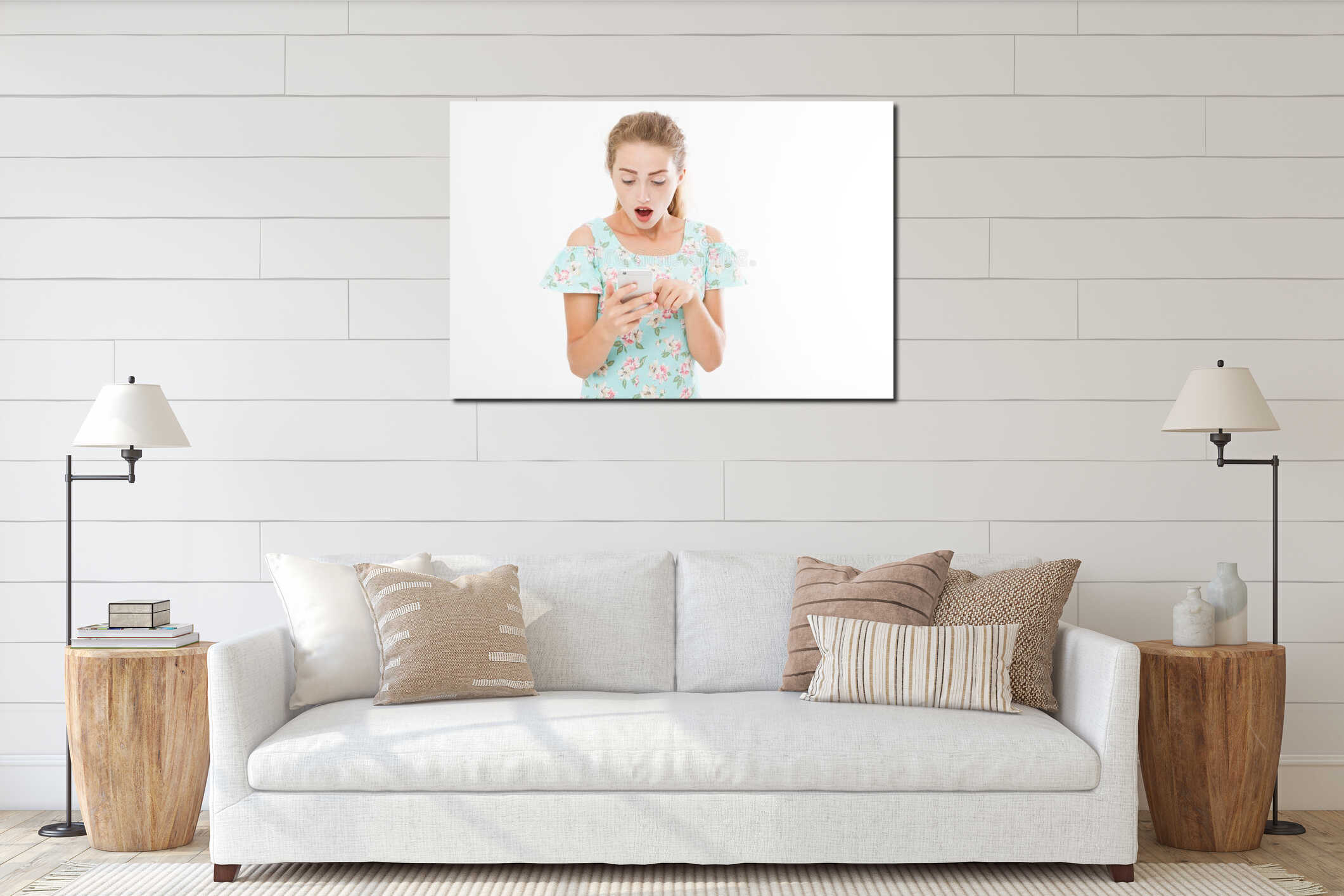 Portrait shocked young girl in dress looking at mobile phone isolated on white background interior mockup