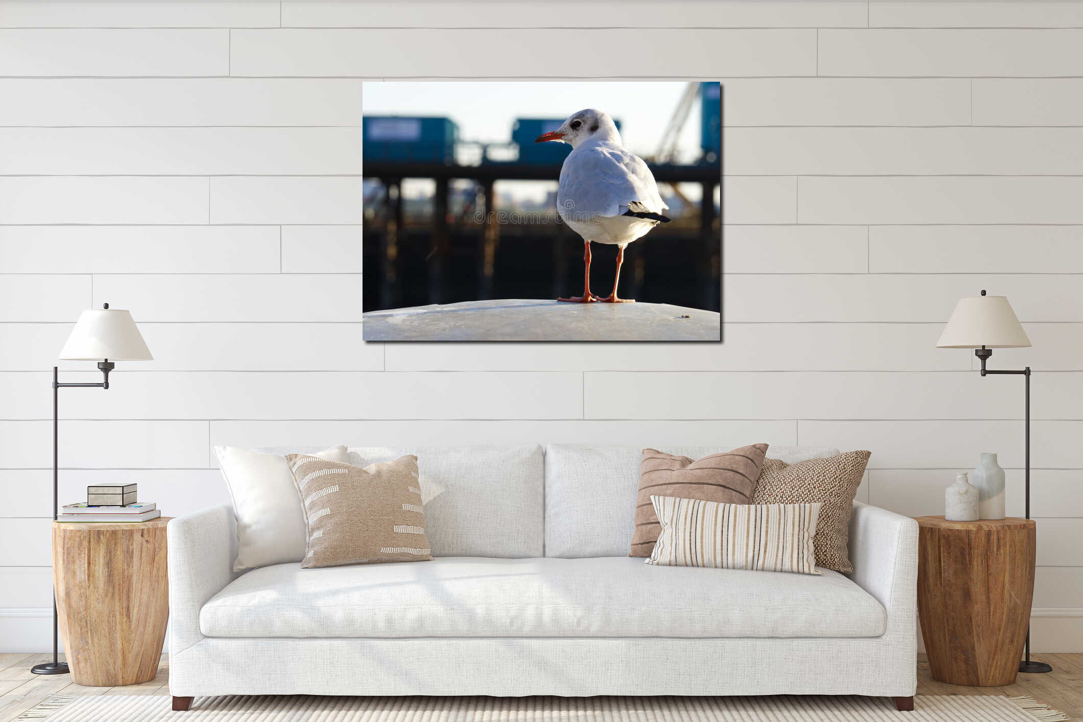 Seagull sitting on post in harbor interior mockup