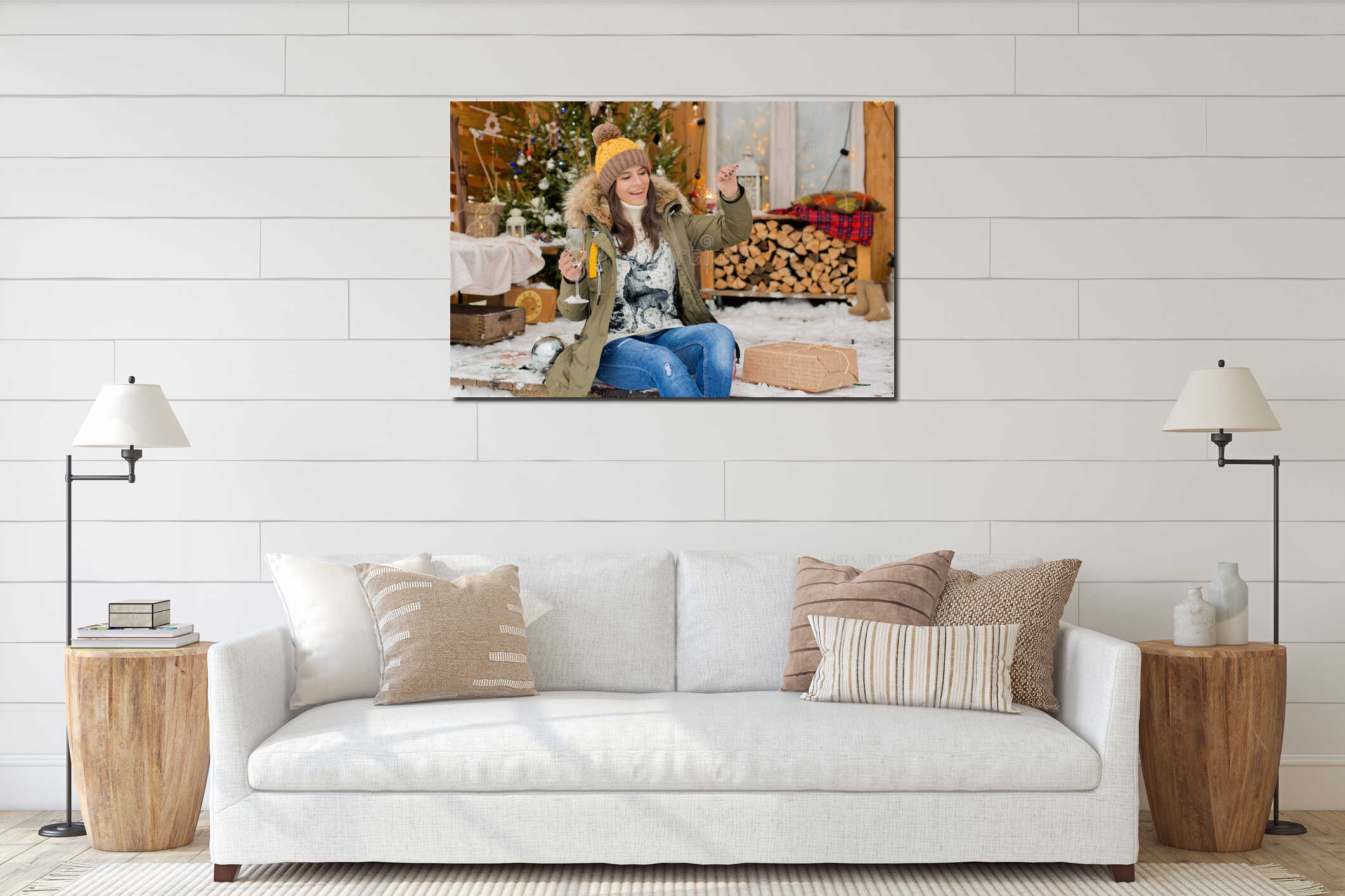 Cheerful girl in a hat and a down jacket with sparklers with a glass of champagne in her hand celebrates Christmas. interior mockup