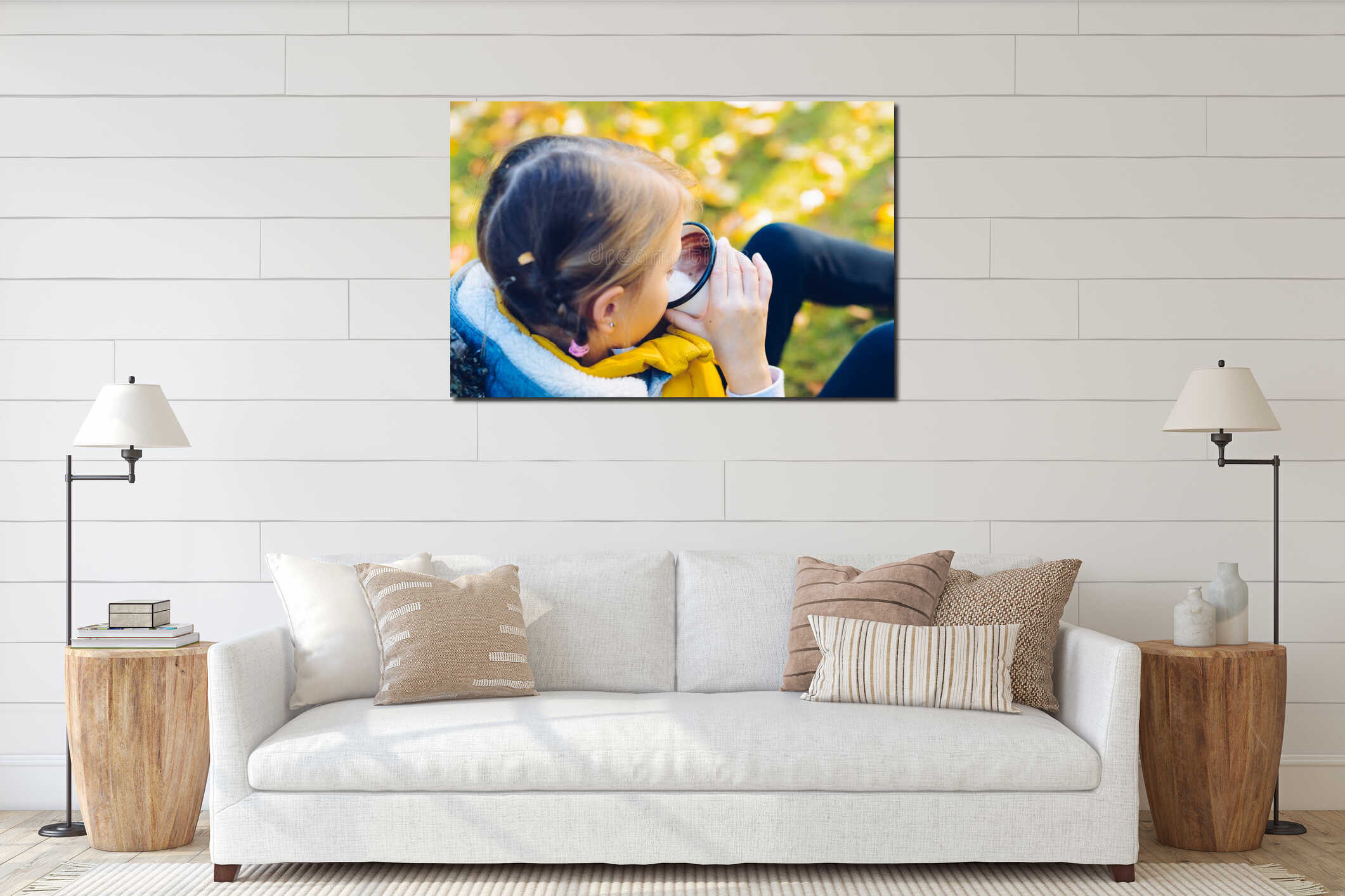 child girl drinking chocolate from a cup dressed in a warm yellow vest in autumn scenery interior mockup