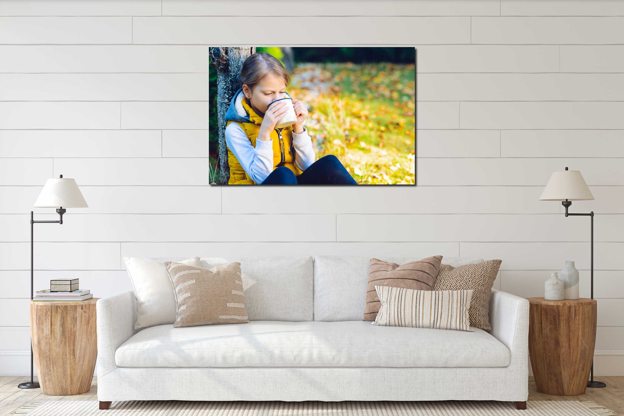 child girl drinking chocolate from a cup dressed in a warm yellow vest in autumn scenery interior mockup
