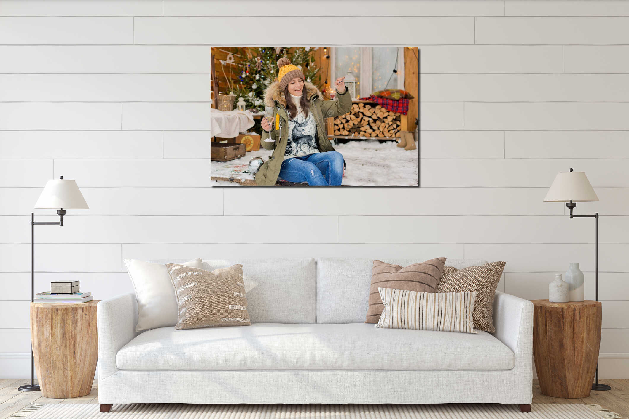 Cheerful girl in a hat and a down jacket with sparklers with a glass of champagne in her hand celebrates Christmas. interior mockup