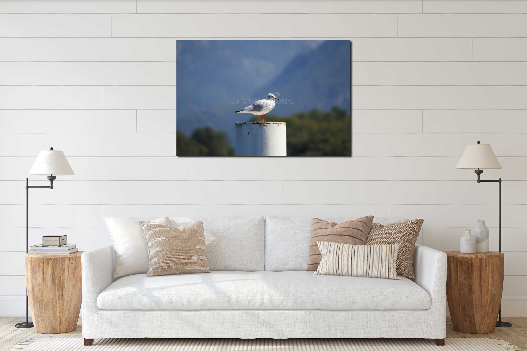 Seagull sitting on a pier on the shore of Lake Como, Italy, interior mockup