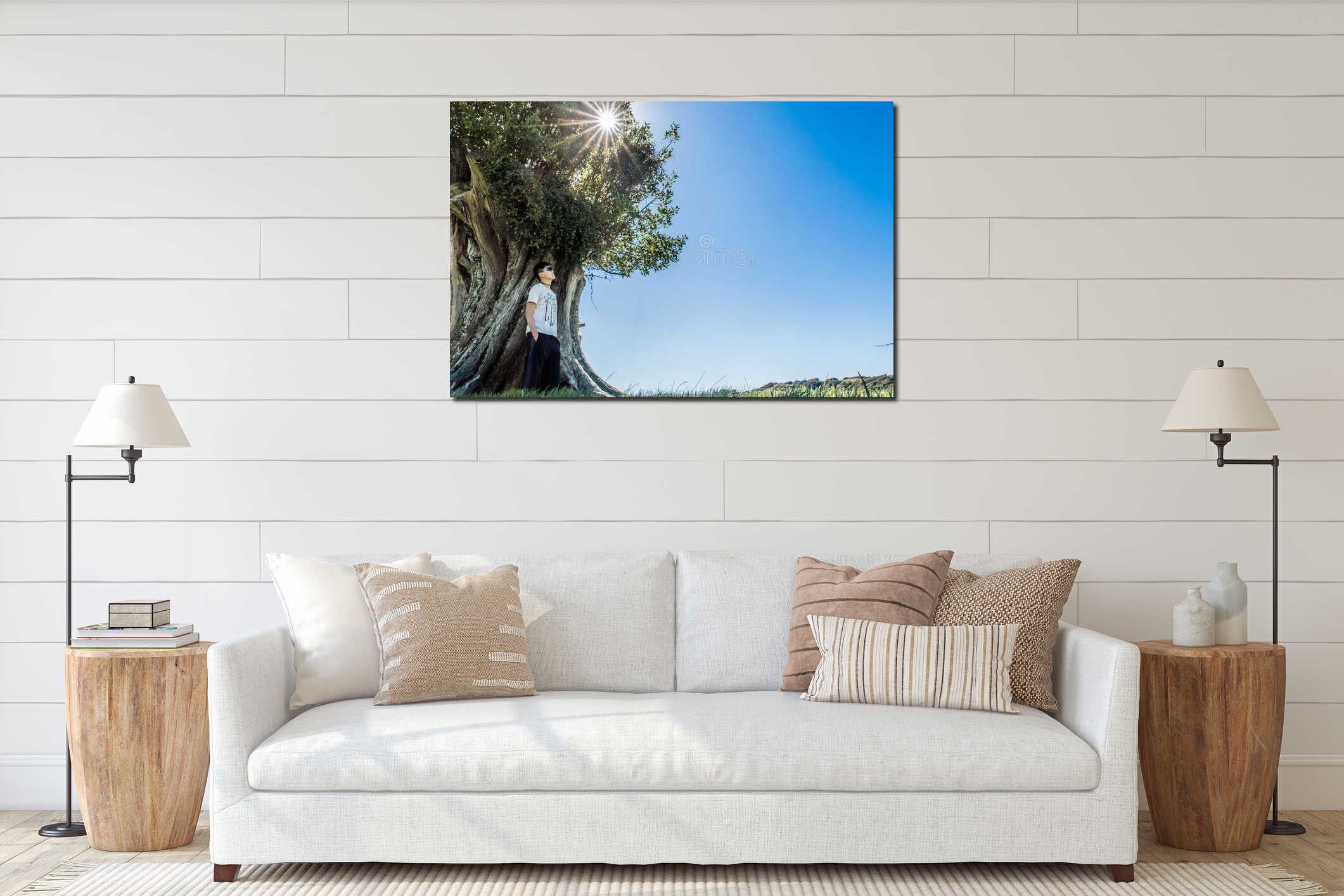 Peaceful image of young man stands against a tree interior mockup