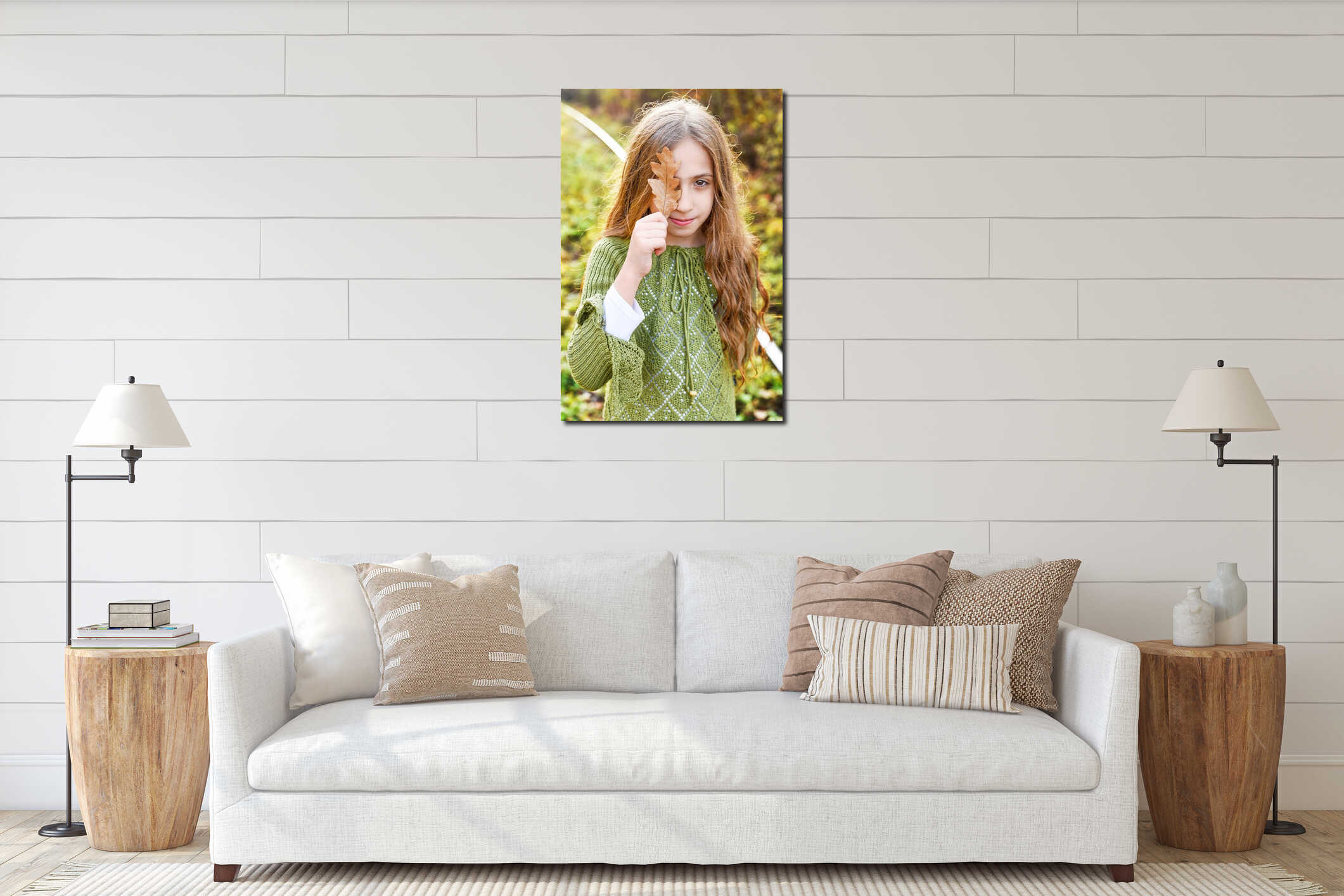 Beautiful happy girl with a smile holds an autumn yellow leaf near the face interior mockup
