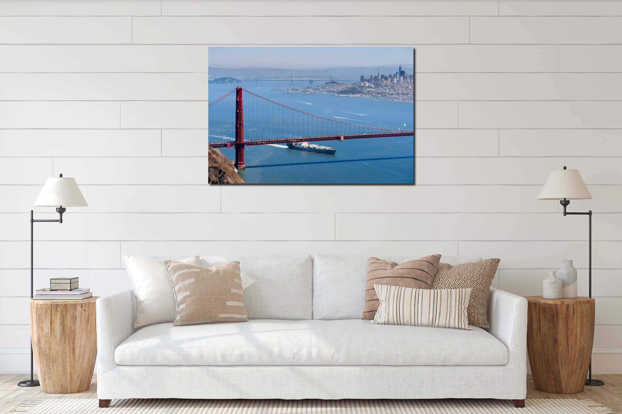 Cargo ship passing under Golden Gate Bridge on a sunny day; San Francisco skyline in the background; California interior mockup