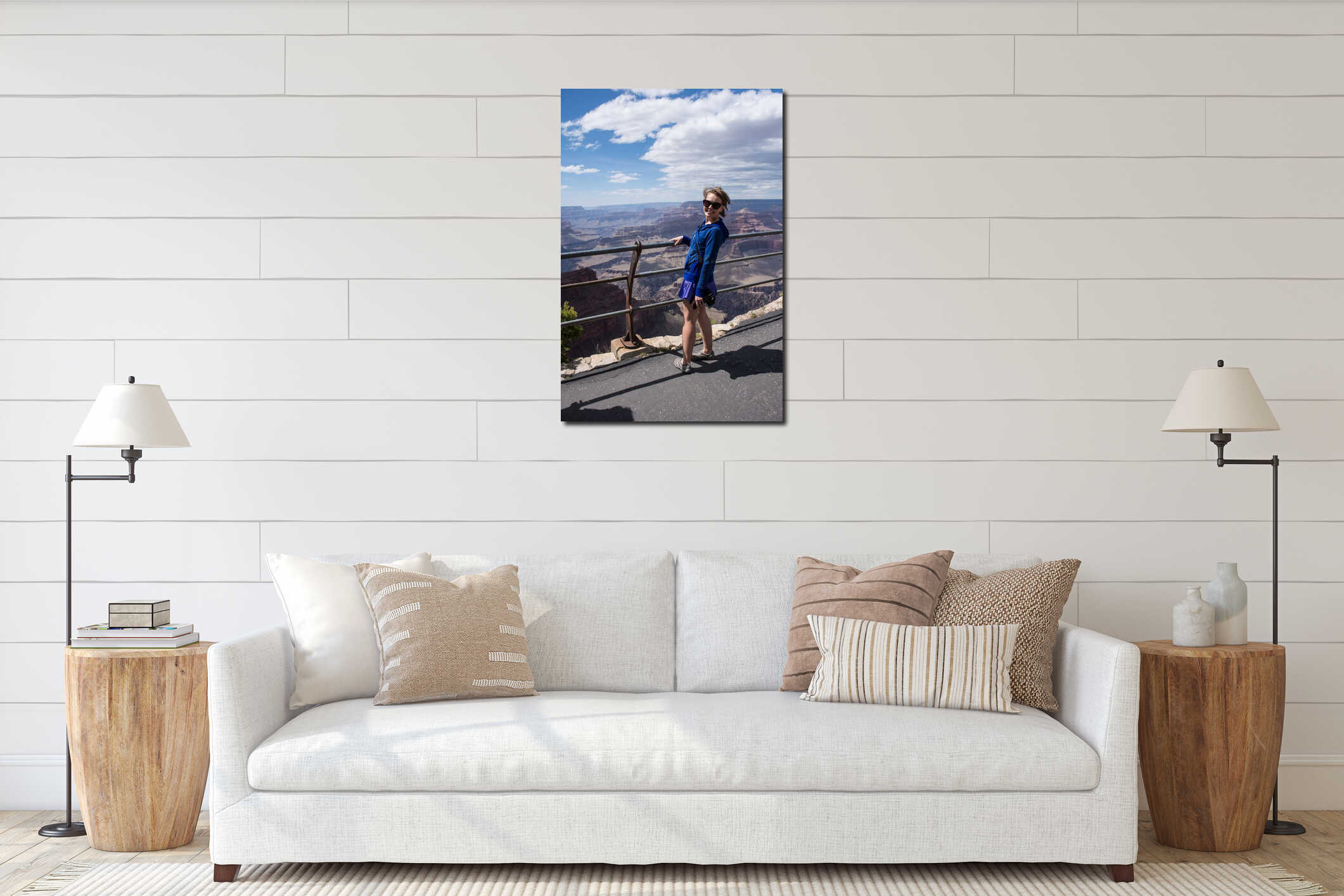 Female tourist stands close to the edge railing at an overlook at Grand Canyon National Park in Arizona interior mockup