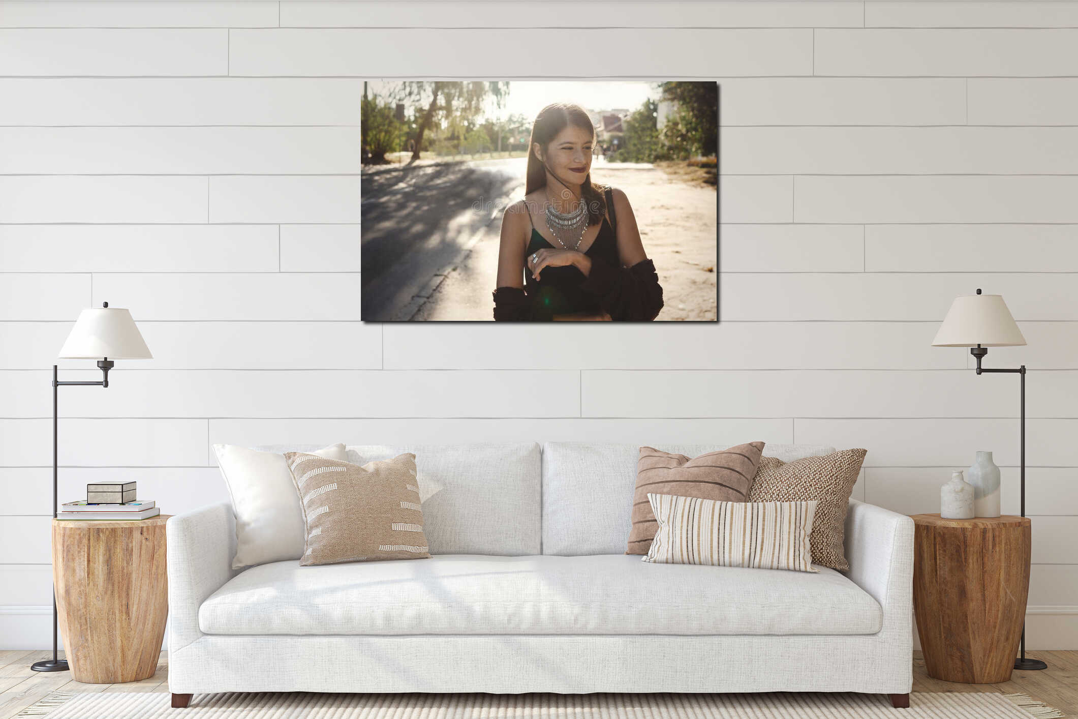 Stylish bohemian girl with modern jewelry walking in sunny street. Happy hipster carefree girl in boho look posing in summer city interior mockup