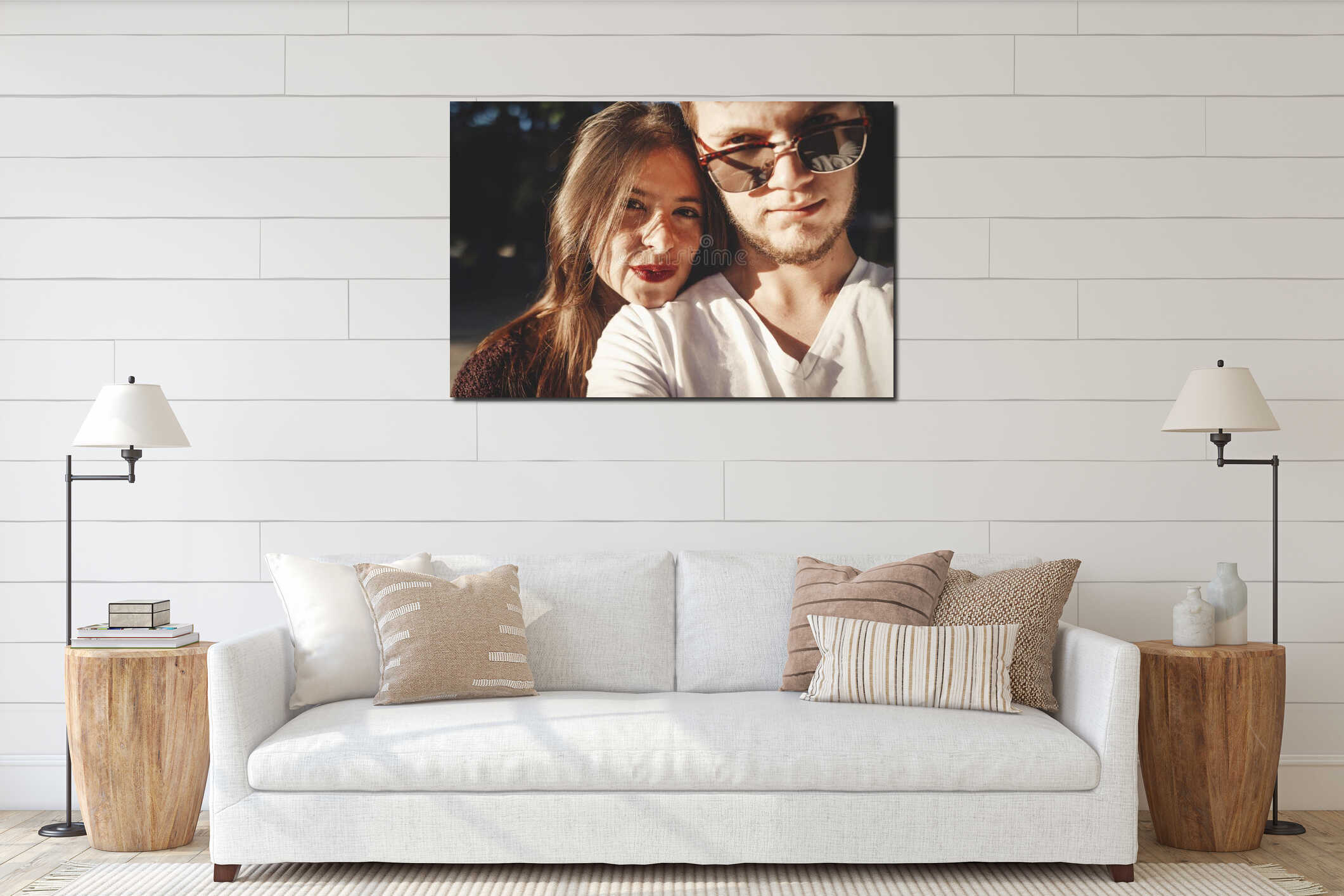 Stylish hipster couple making selfie and embracing in sunlight. Happy family couple in love making self portrait and smiling in interior mockup