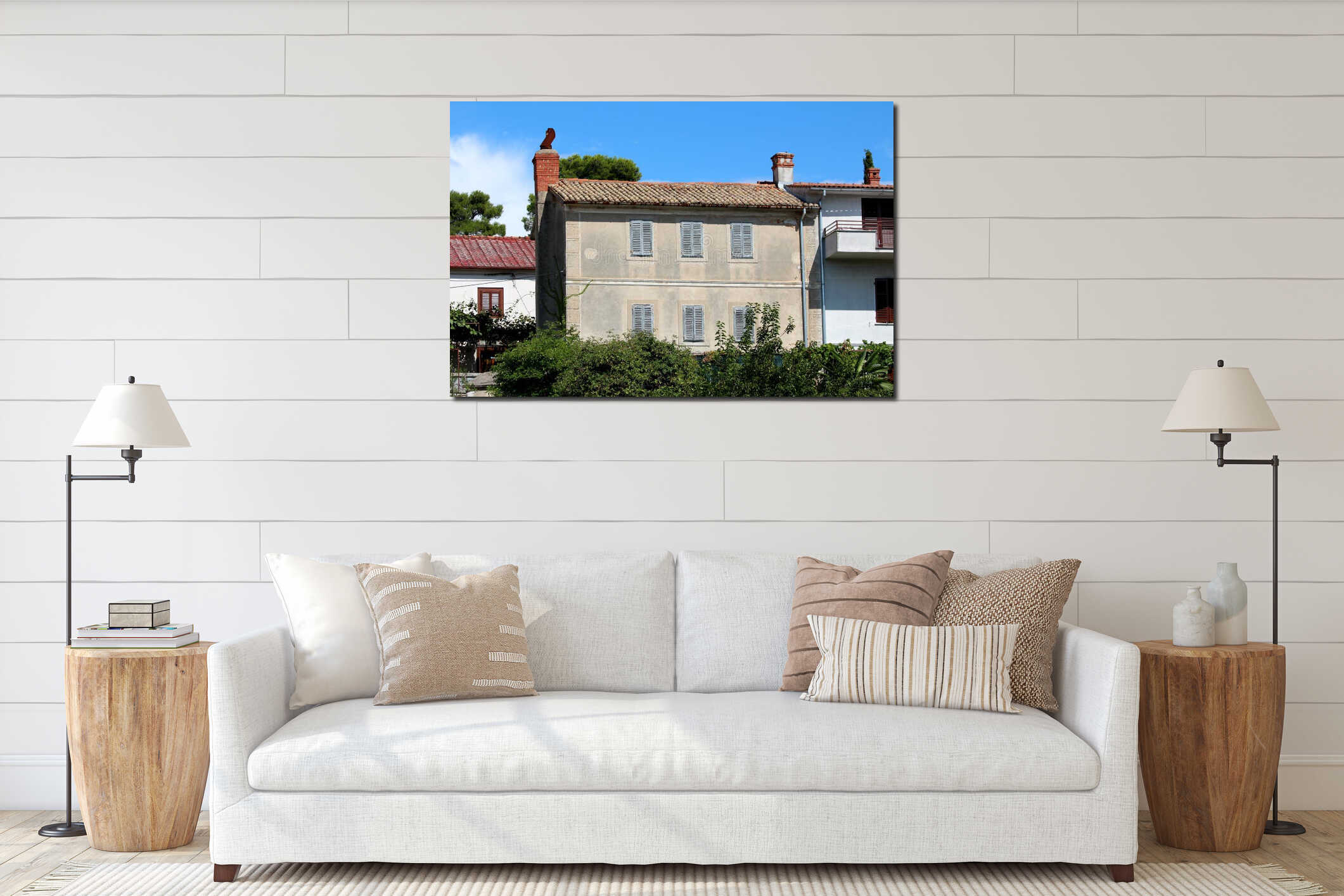 Large old stone Mediterranean house with closed dilapidated wooden window blinds and rusted chimney surrounded with other houses interior mockup