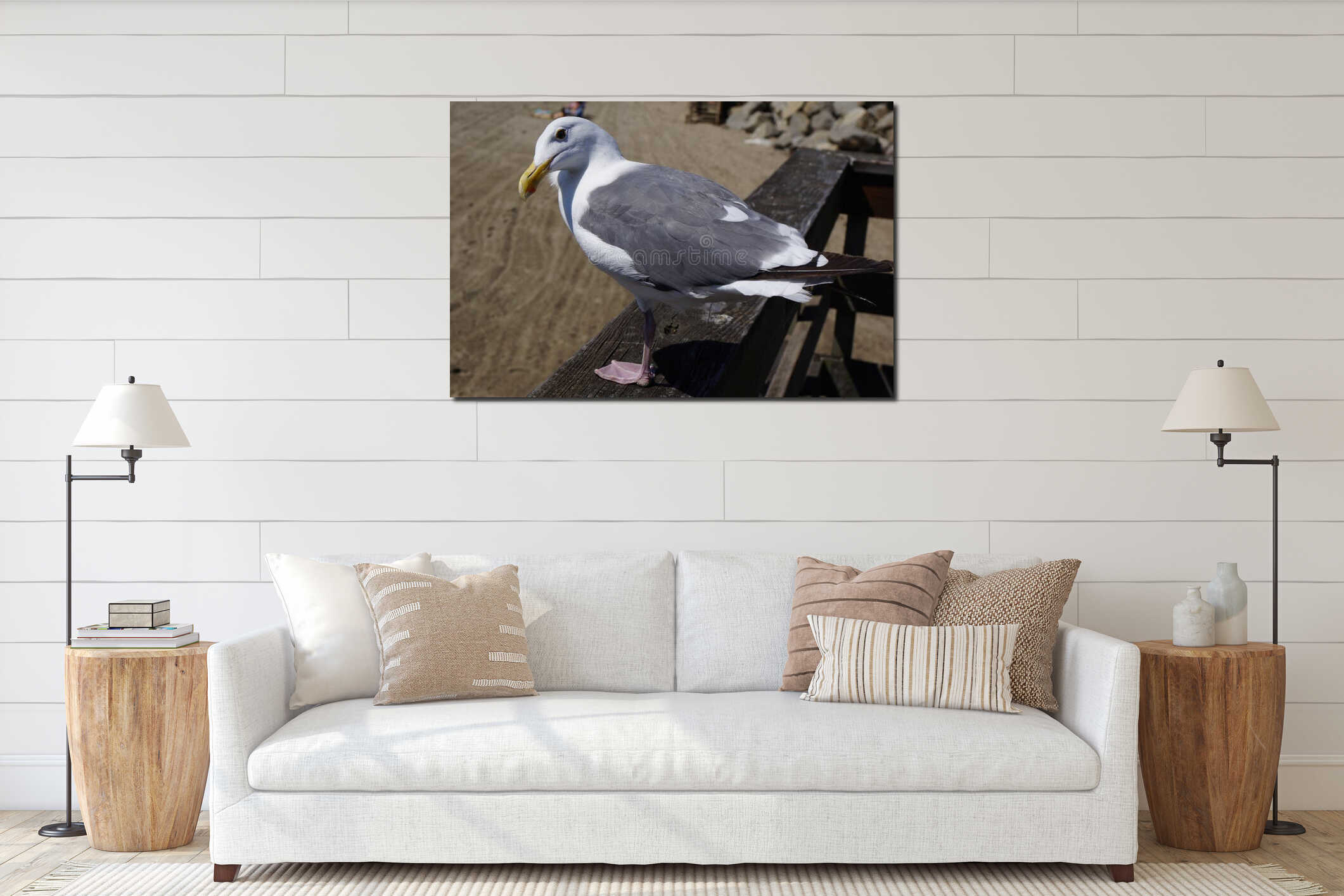 Seagull sitting on wooden rail at beach interior mockup