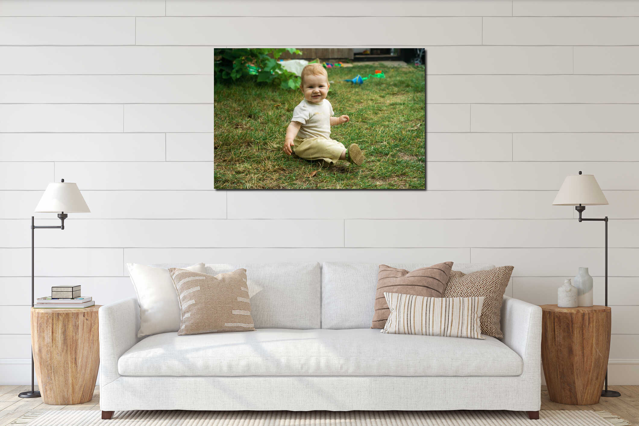 The child happily crawls and sits on the green grass. Toddler smiles and moves on all fours around the yard in the open air interior mockup