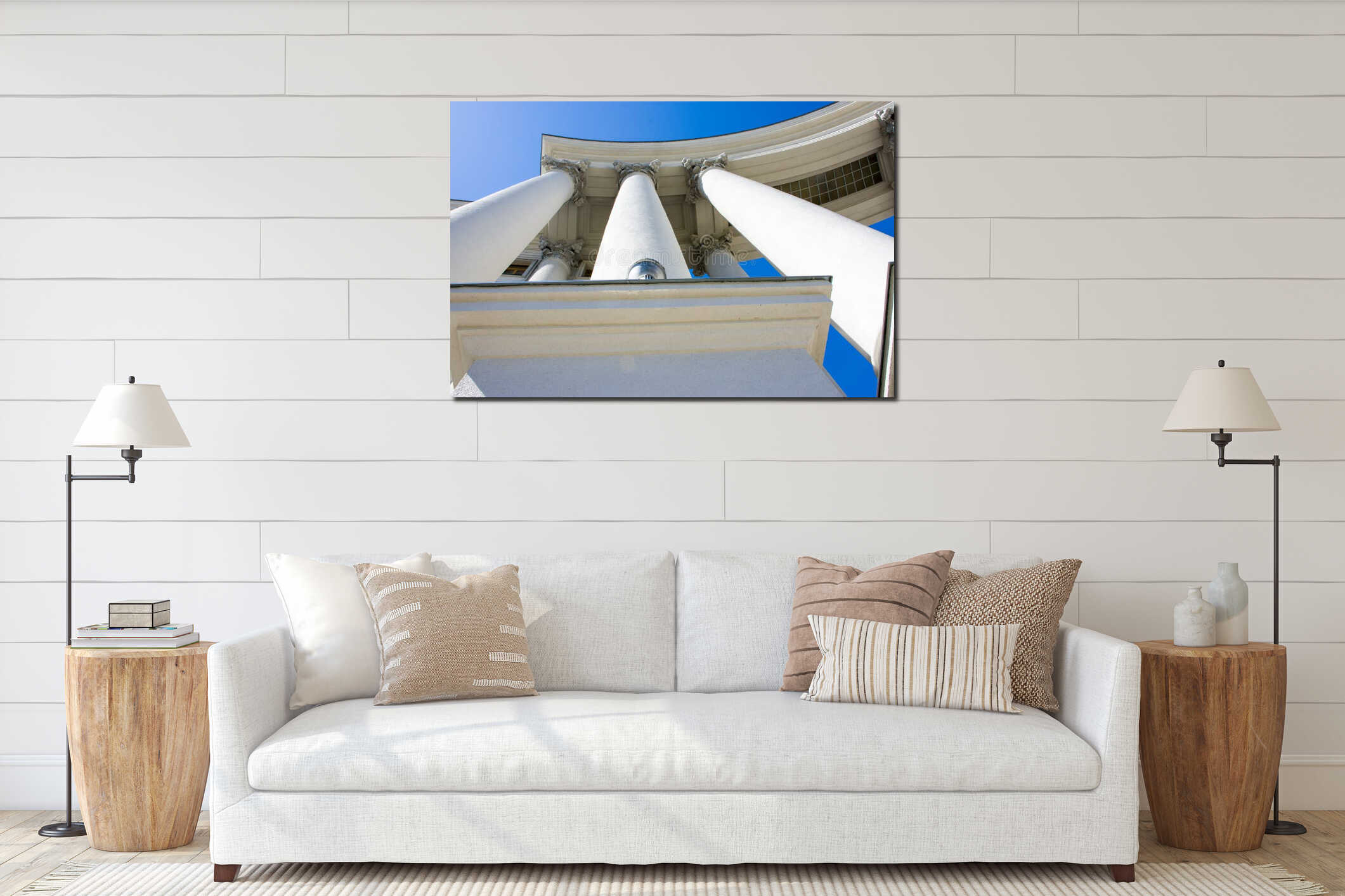 Three big concrete columns with bases hold the roof against the blue sky bottom view. The architecture of the Empire style interior mockup