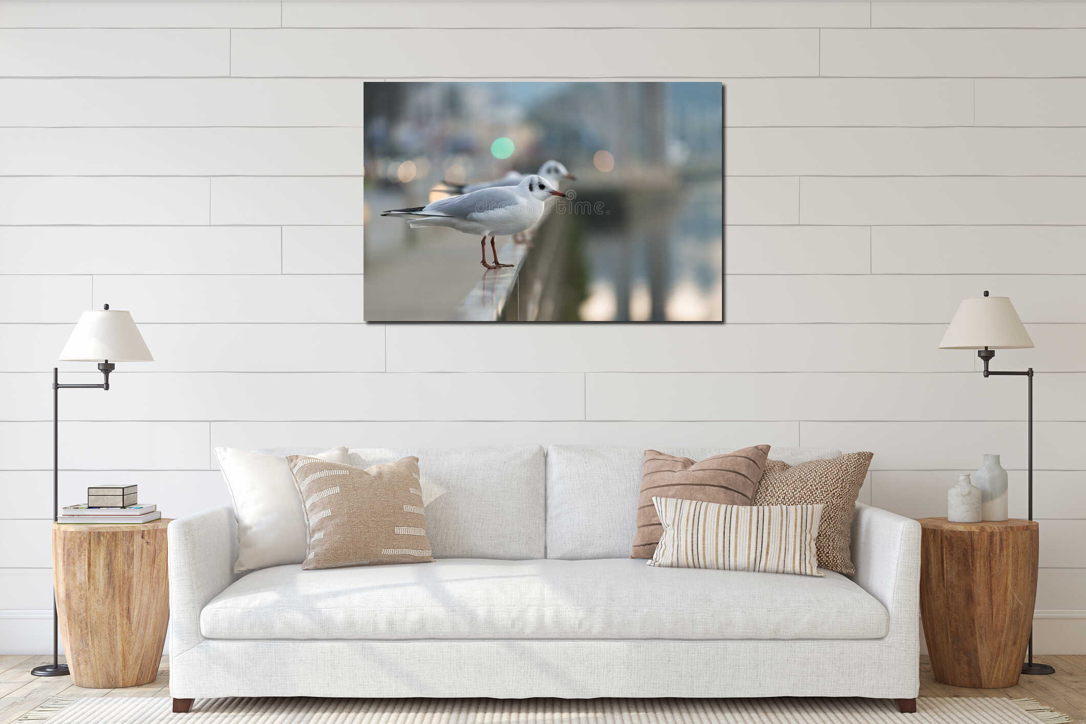 A small seagull perched on a stainless steel railing interior mockup