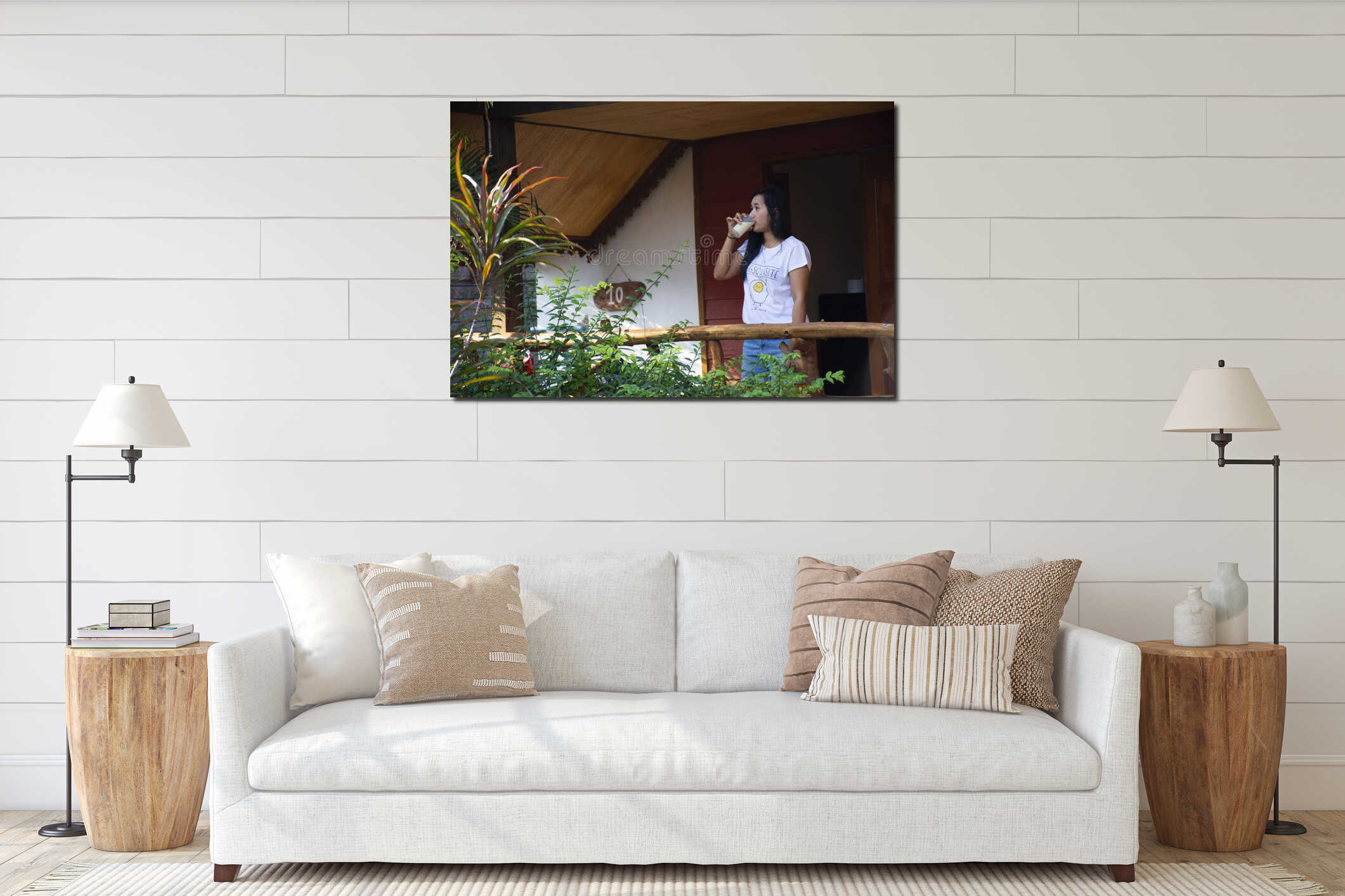 Asian thai woman drinking soy milk on patio of wooden hut of resort and homestay in morning time in Chaiyaphum, Thailand interior mockup