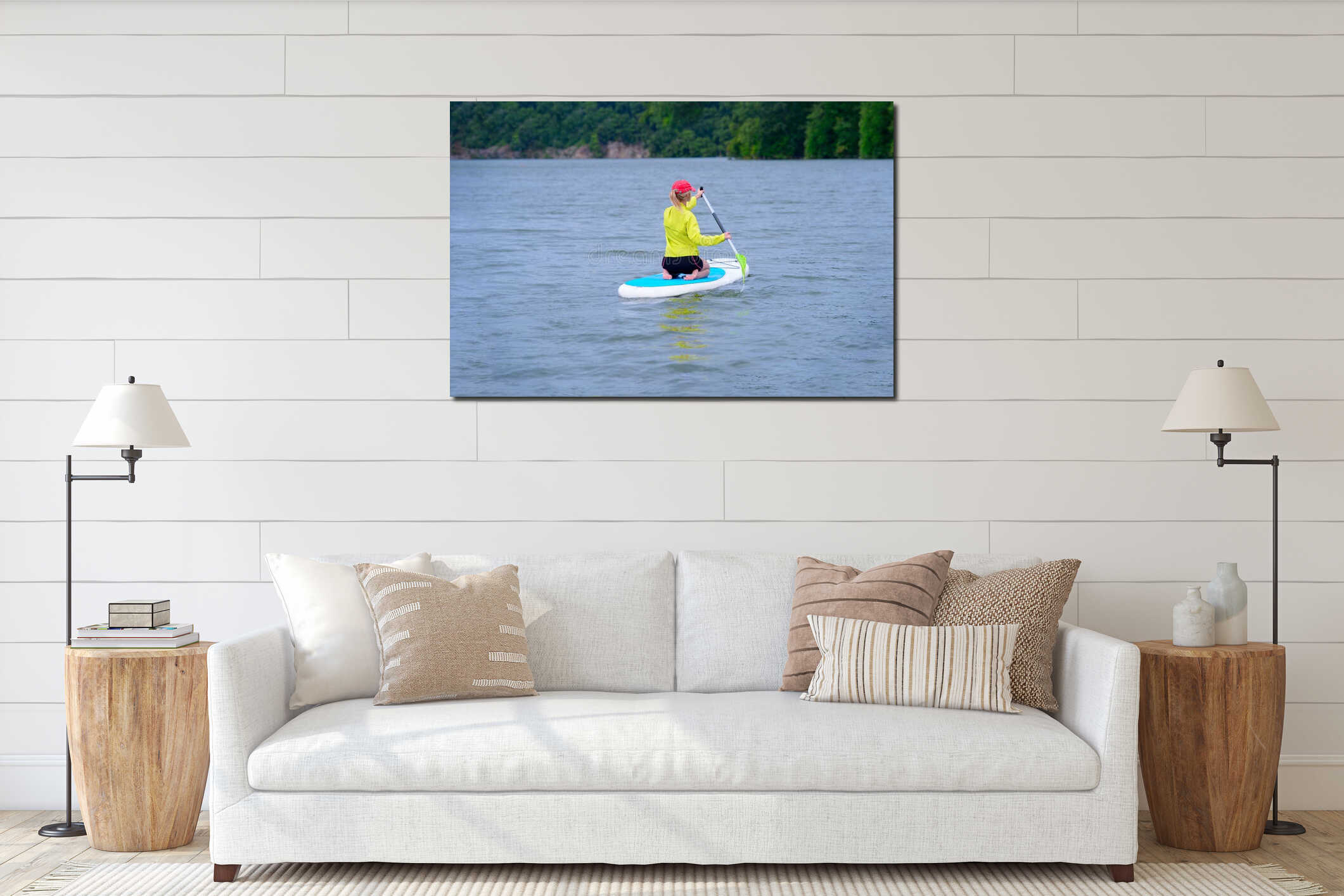 A woman sits aboard and looks at the horizon. Travel and the concept of water activity. Empty space and water background interior mockup