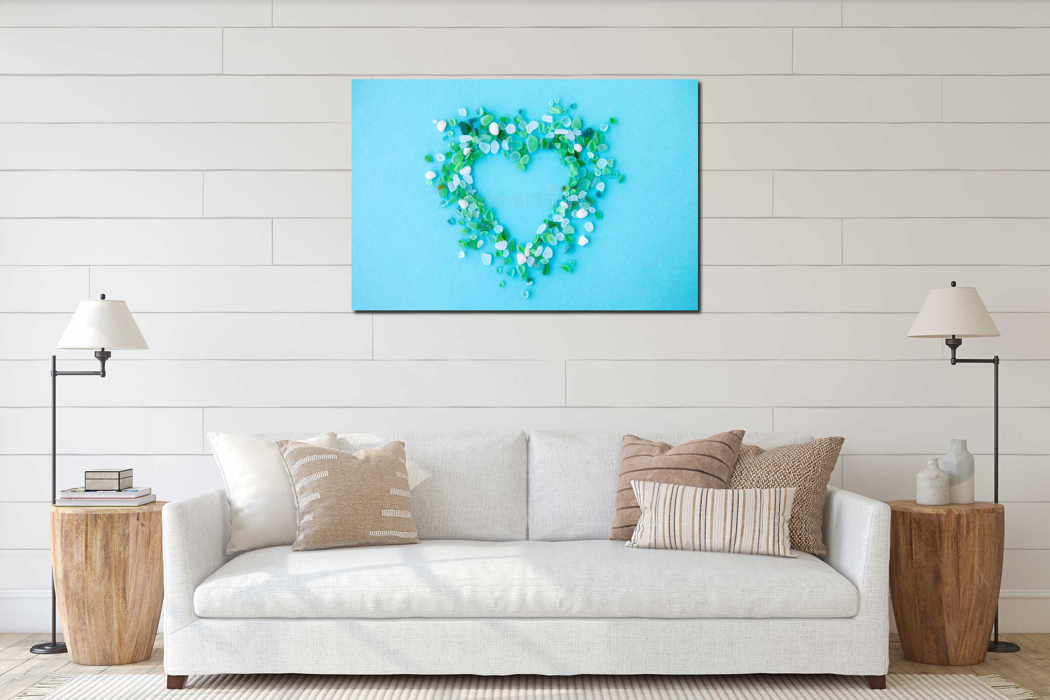 Sea glass pieces in the shape of a heart on blue background interior mockup