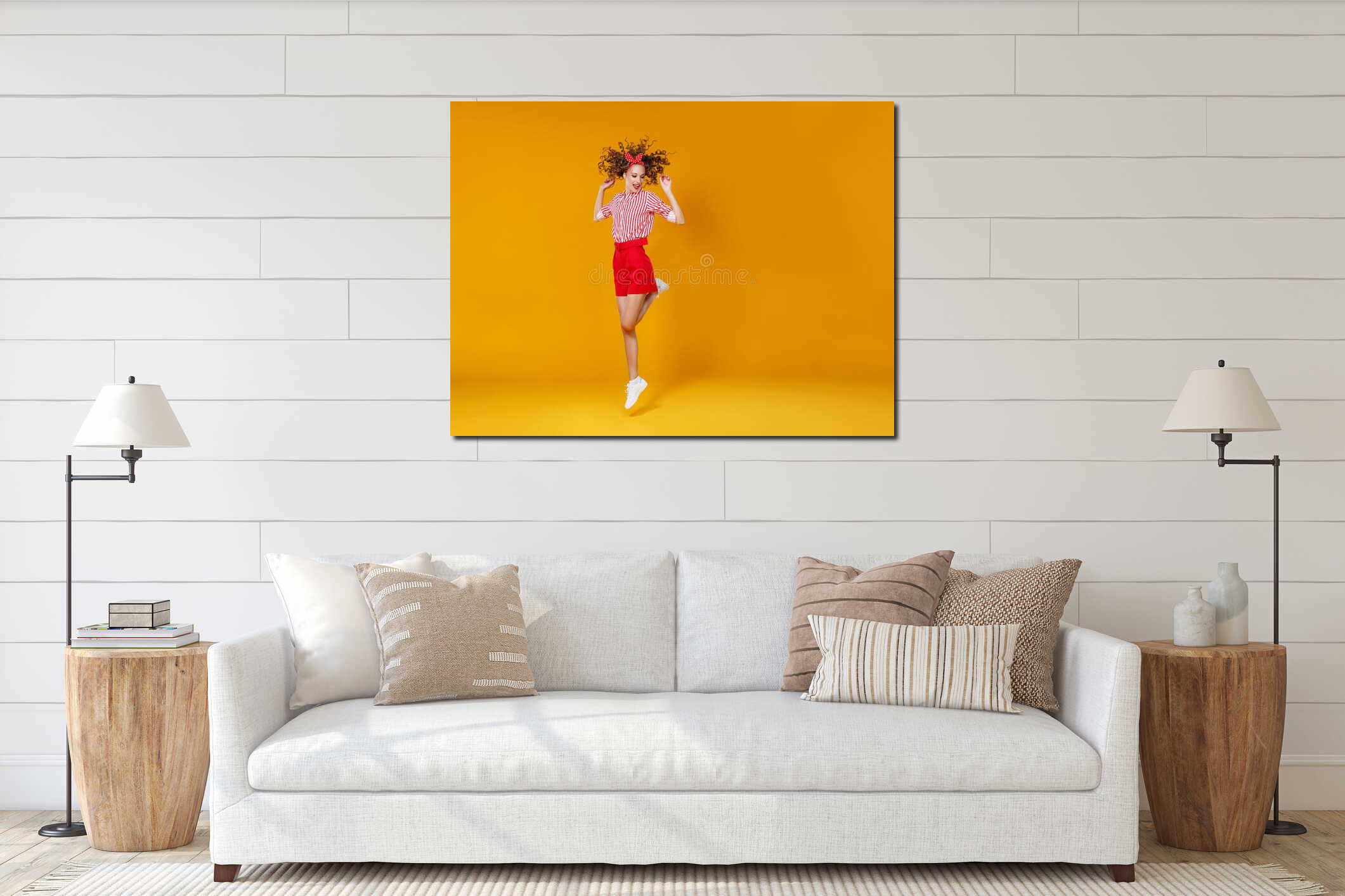 Concept happy emotional young woman in red  jumping   on yellow background interior mockup