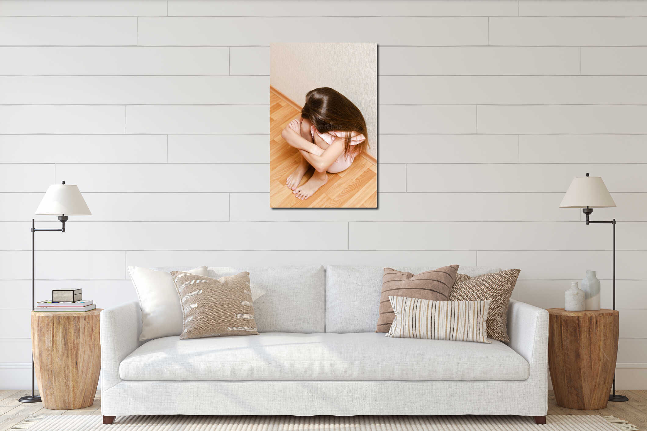 Sad and depressed punished little girl child sitting on the floor near the wall interior mockup