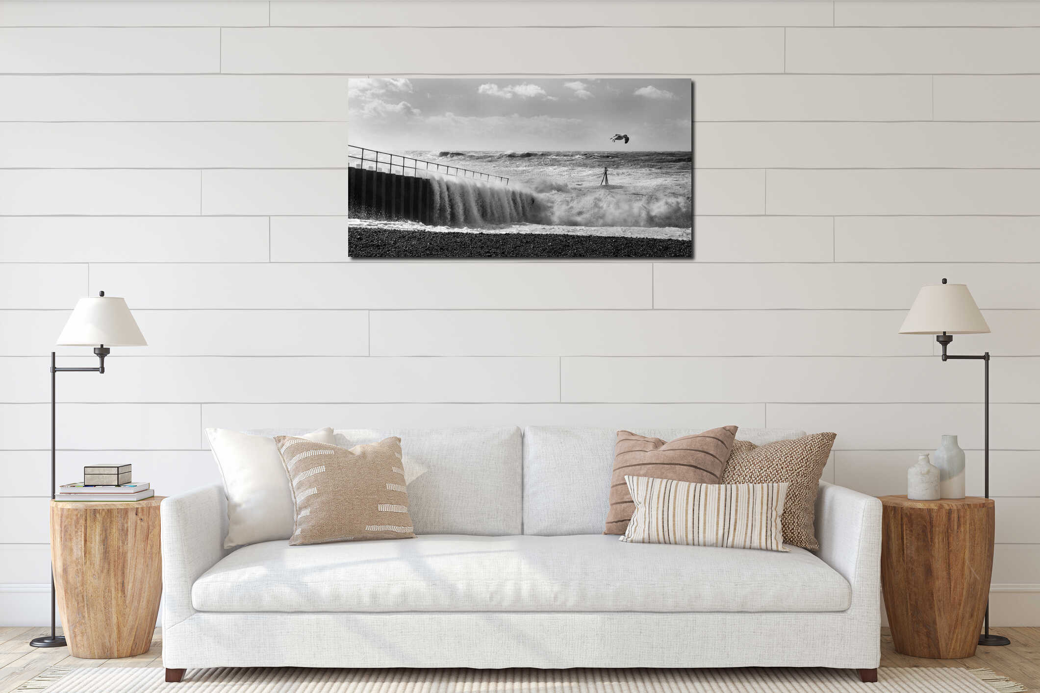 Rough seas crashing against Brighton marina habour wall, a solitary seagull flying against the wind interior mockup