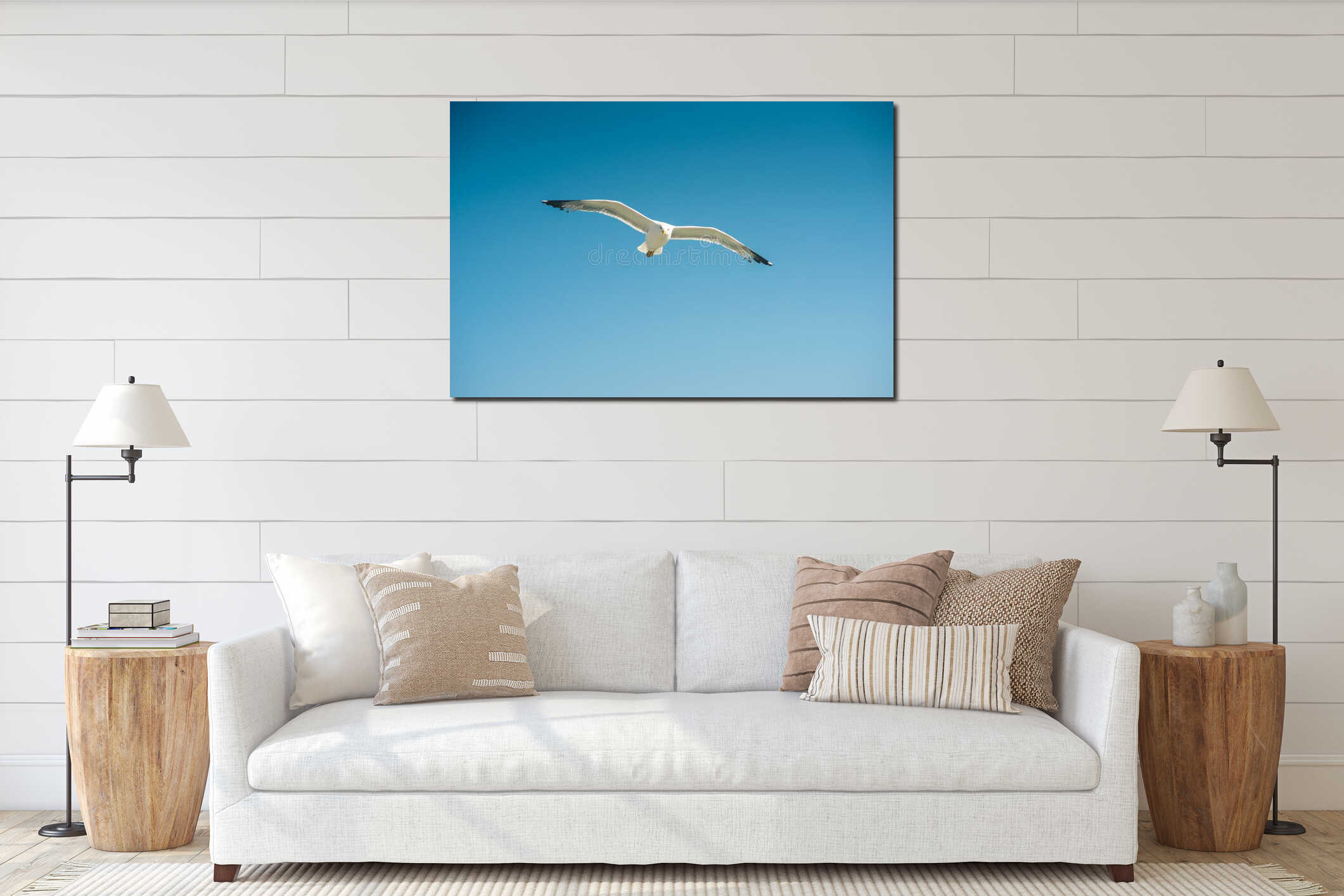 Single seagull flying, blue sky in background interior mockup